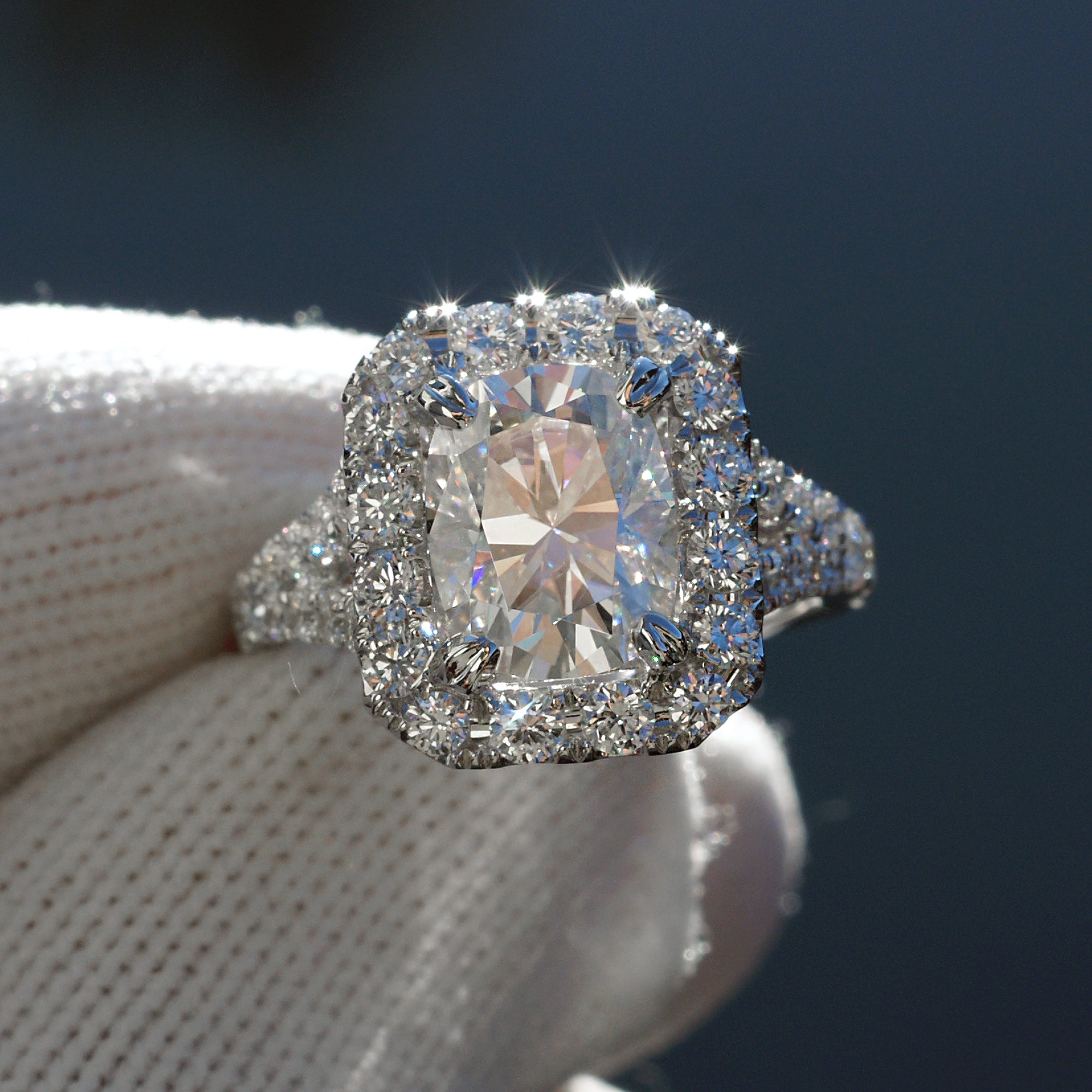 http://www.samnsue.com/cdn/shop/files/moissanite-ring-diamond-halo-split-band-meghan-9x7-1.jpg?v=1699318651&width=2048