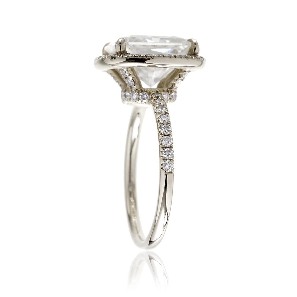 Radiant cut engagement ring with diamond halo and band the Drenched white gold profile view