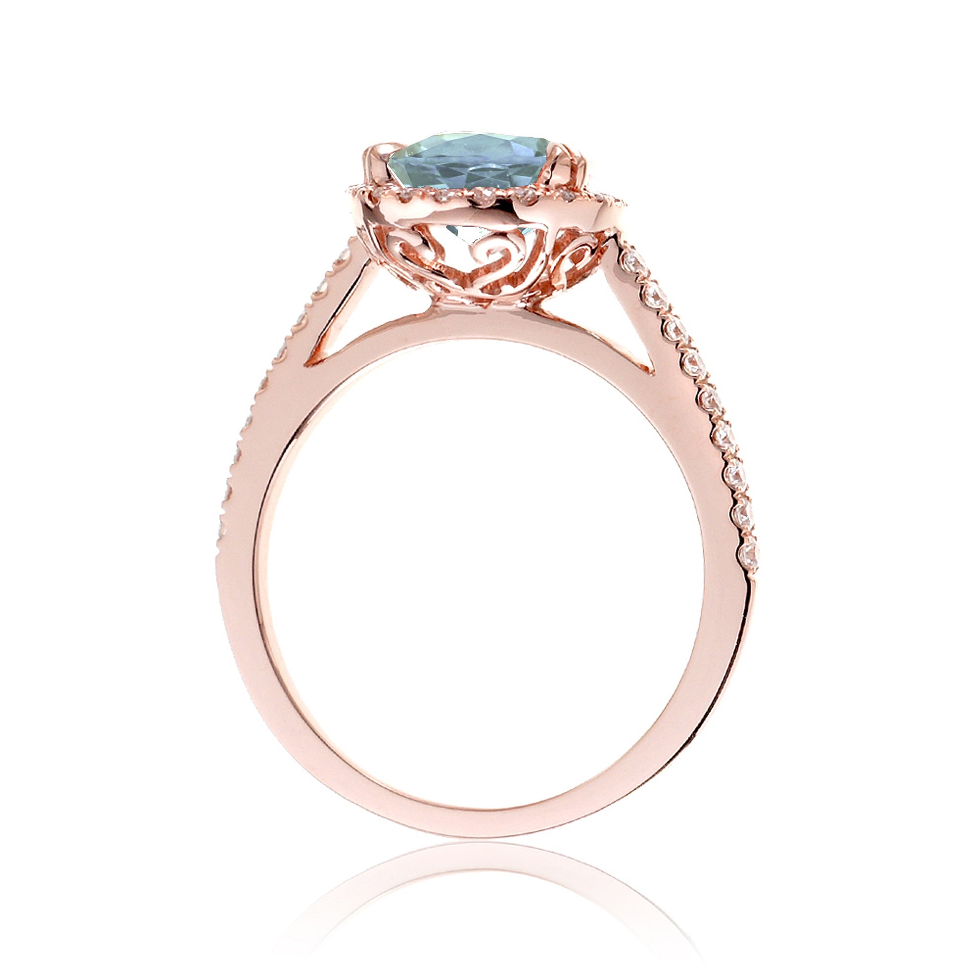 Oval cut aquamarine engagement ring with halo in rose gold