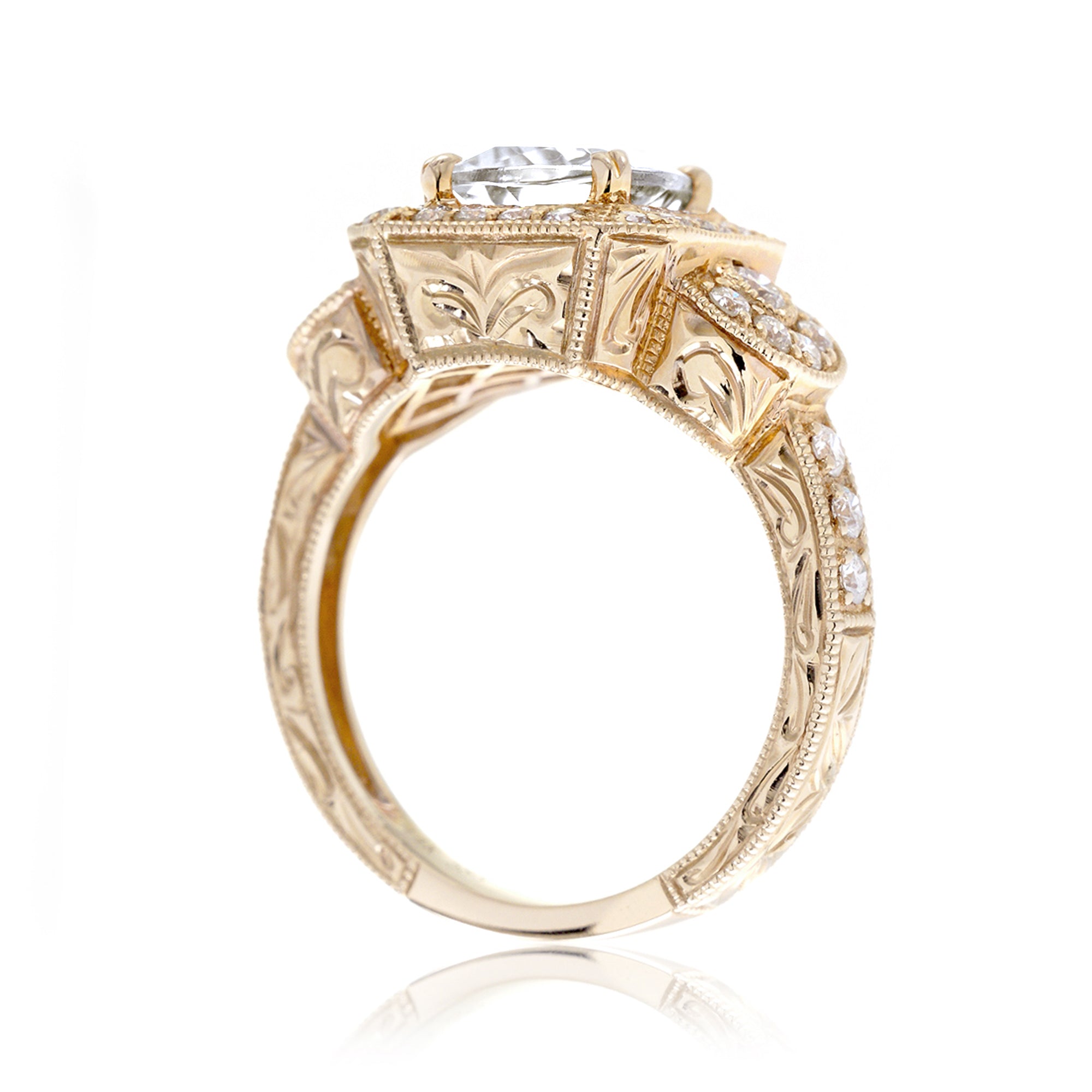 Cushion old miner's cut diamond in a vintage antique style engagement ring yellow gold