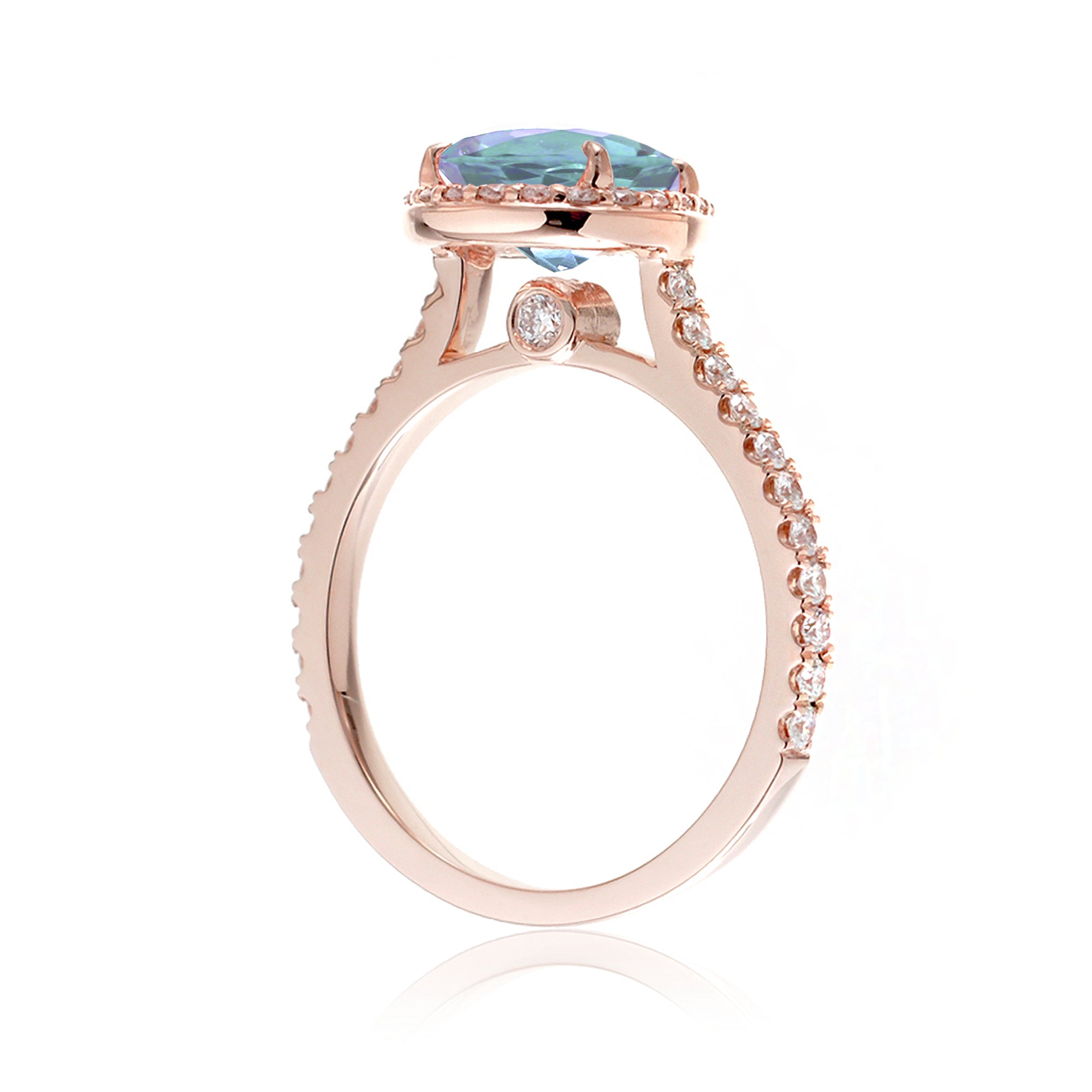 Pear aquamarine halo engagement ring in the Sunset rose gold