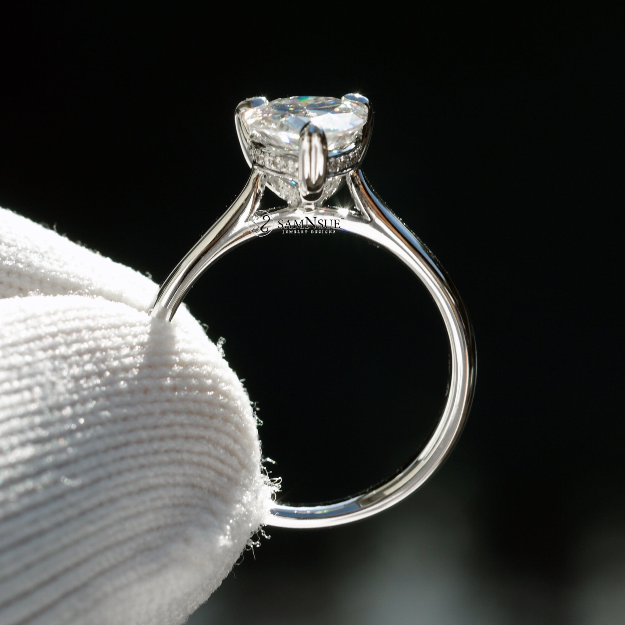 Solitaire pear cut moissanite engagement ring with hidden halo in white gold