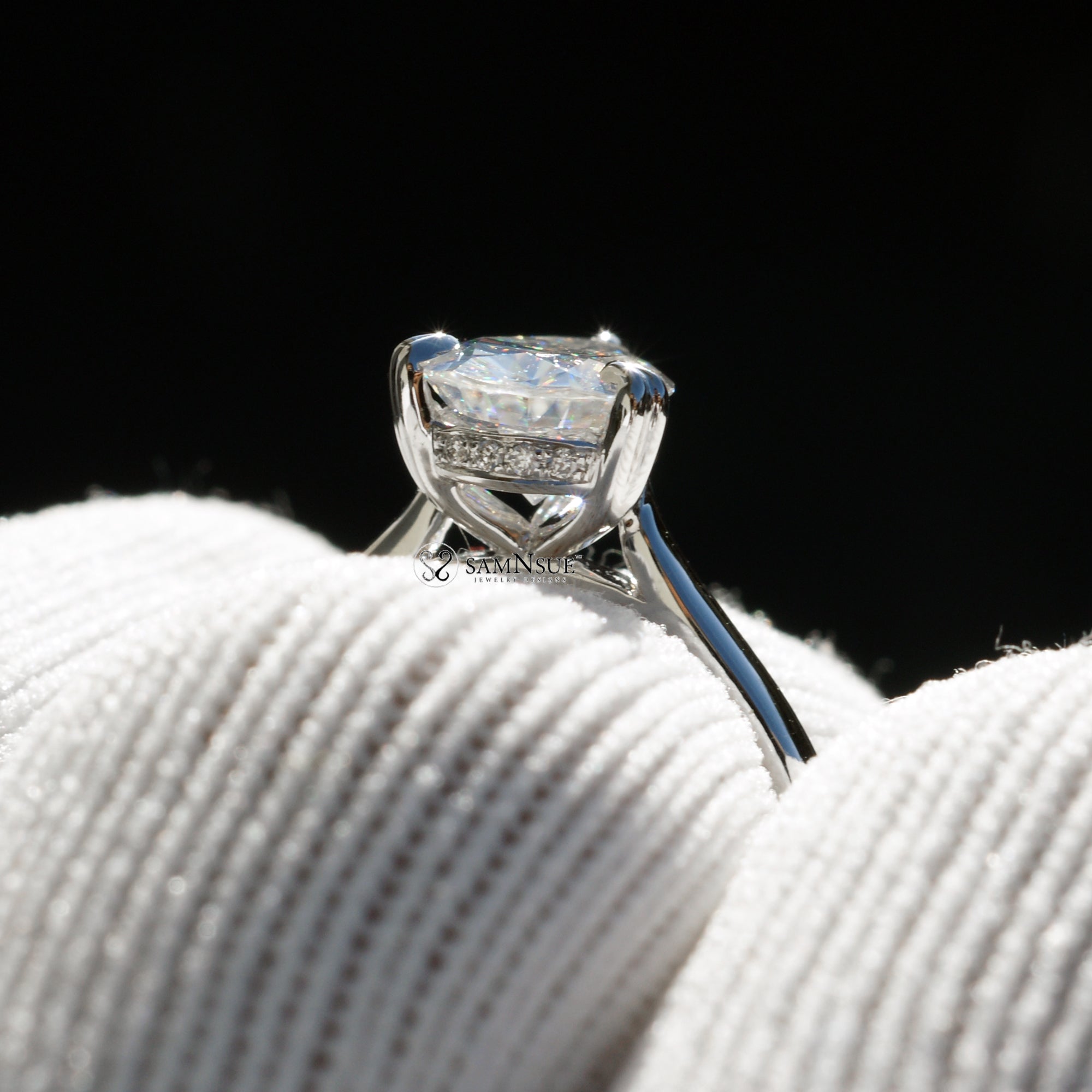 Solitaire pear cut moissanite engagement ring with hidden halo in white gold