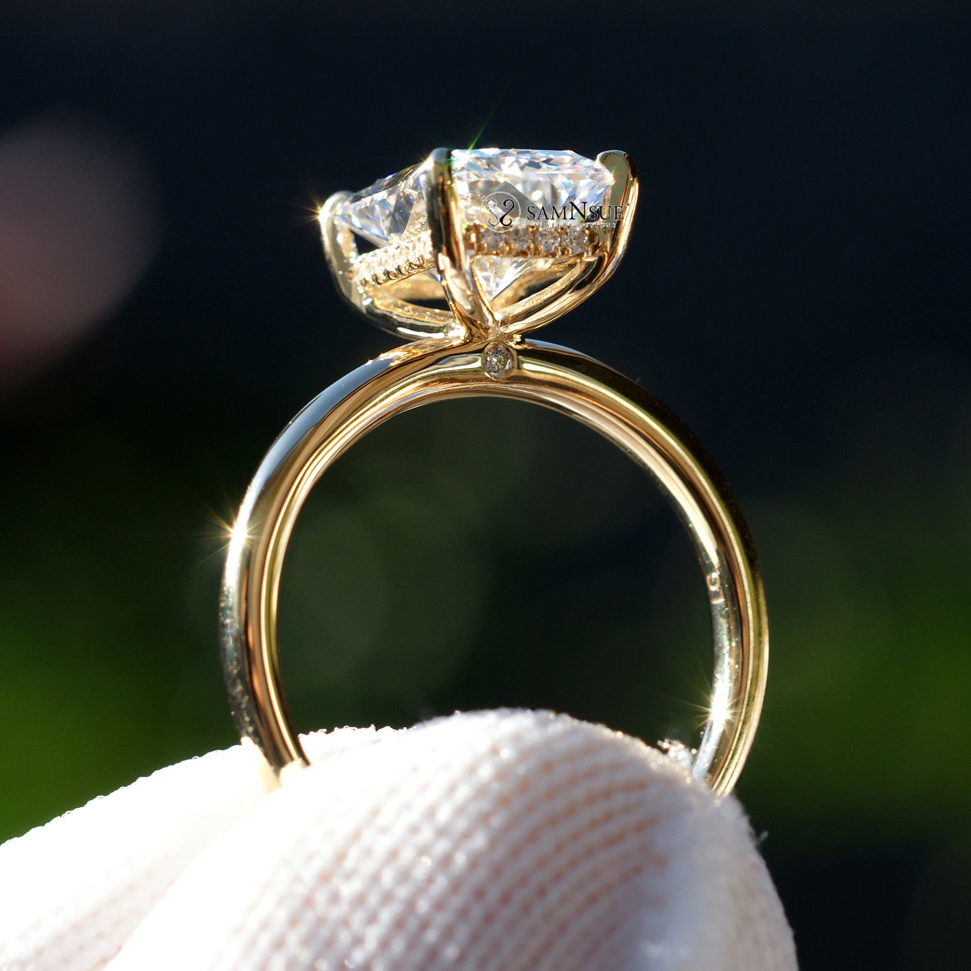 Radiant cut solitaire engagement ring in yellow gold with a hidden halo comfort fit band