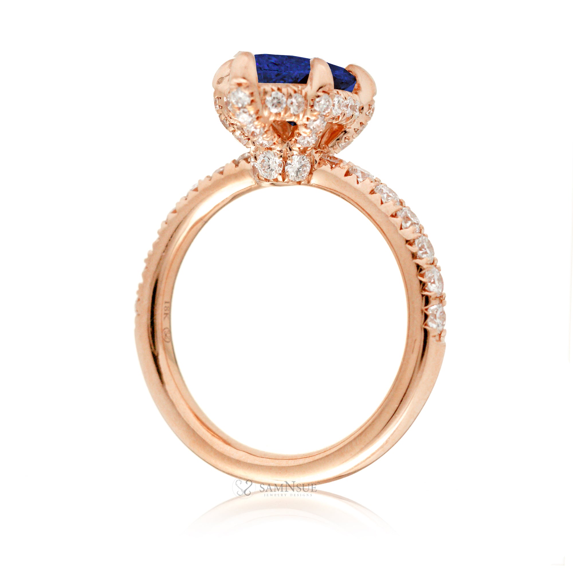 Marquise cut blue sapphire engagement ring with hidden halo and rounded diamond band for a comfort fit rose gold