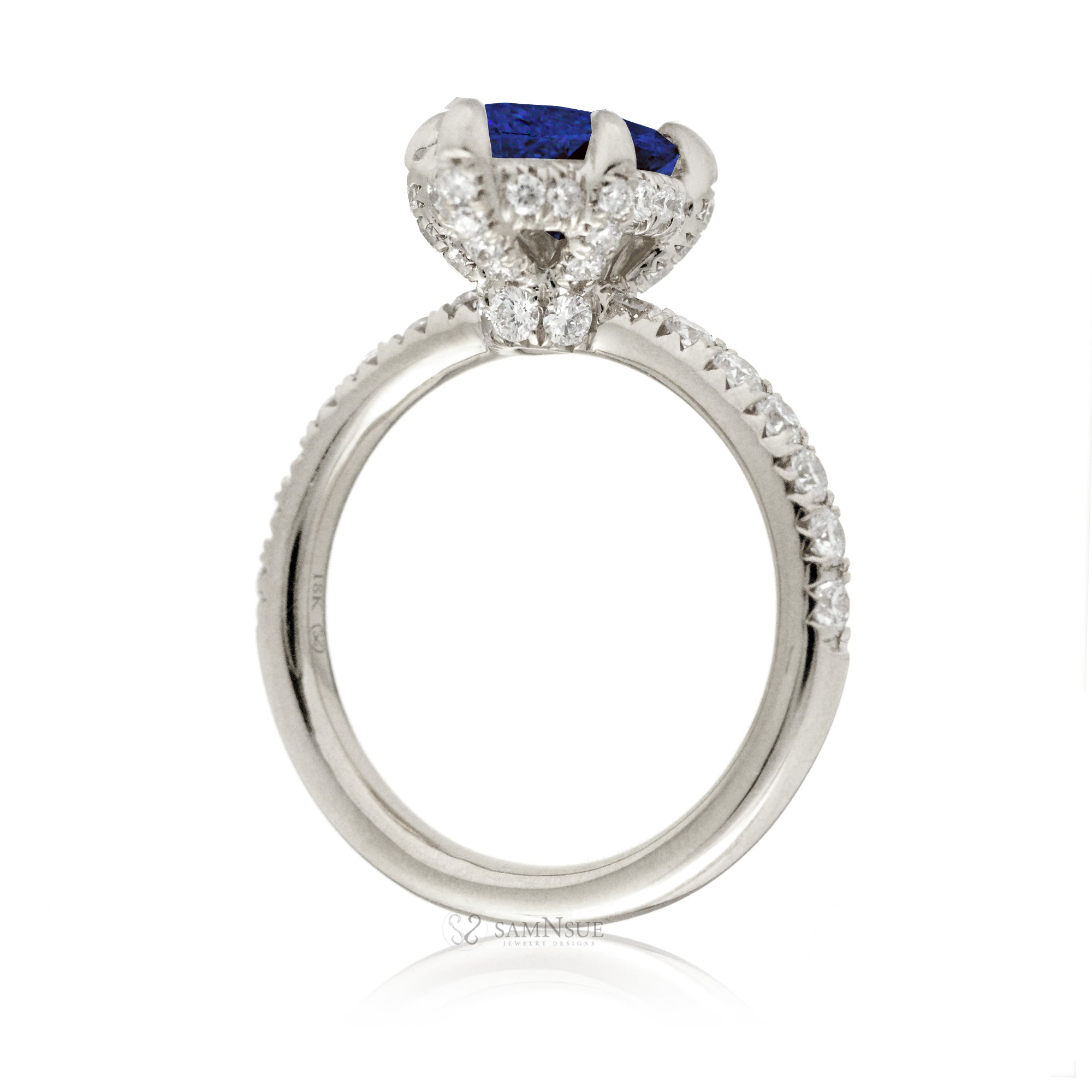 Marquise cut blue sapphire engagement ring with hidden halo and rounded diamond band for a comfort fit white gold