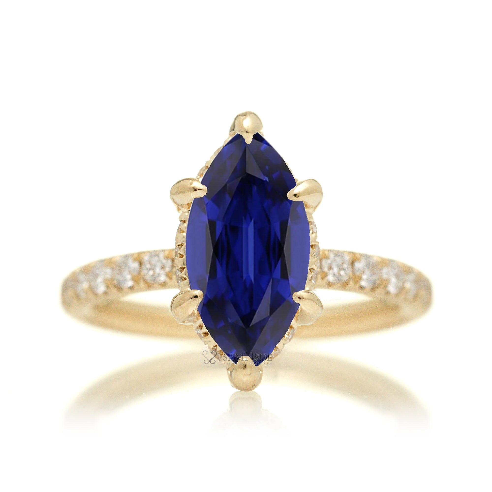 Marquise cut blue sapphire engagement ring with hidden halo and rounded diamond band for a comfort fit yellow gold