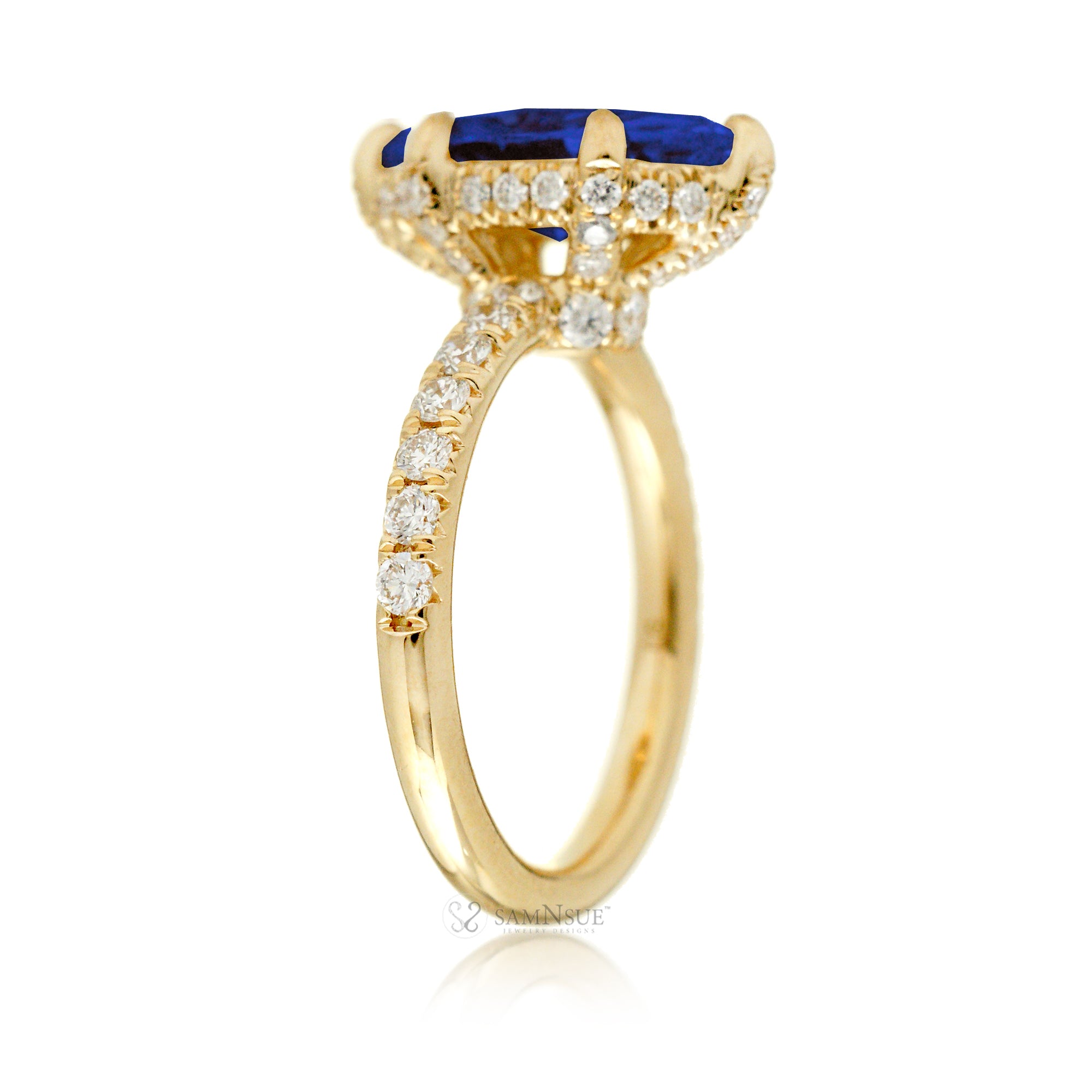 Marquise cut blue sapphire engagement ring with hidden halo and rounded diamond band for a comfort fit yellow gold