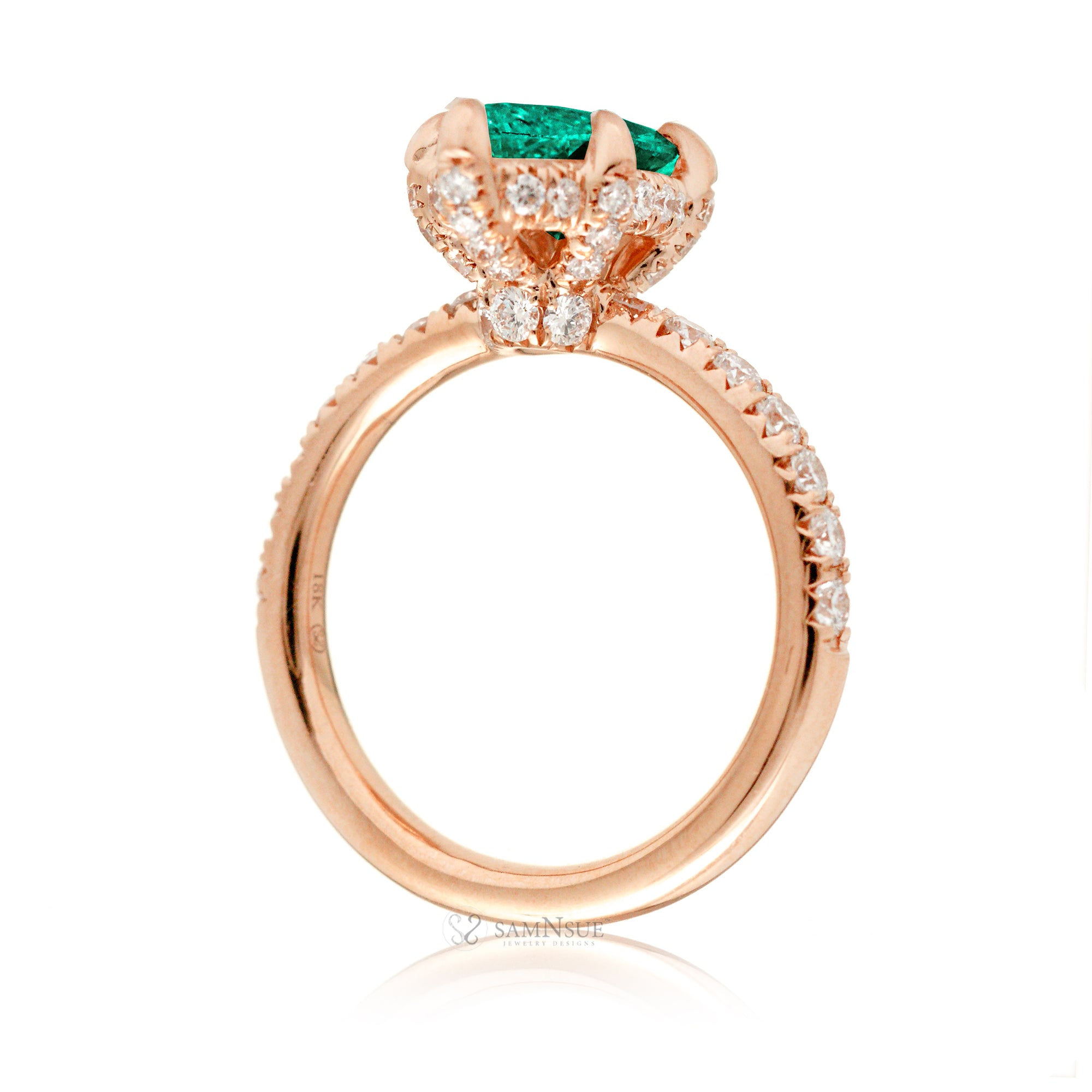 Marquise cut engagement ring with hidden halo and a rounded diamond band in rose gold