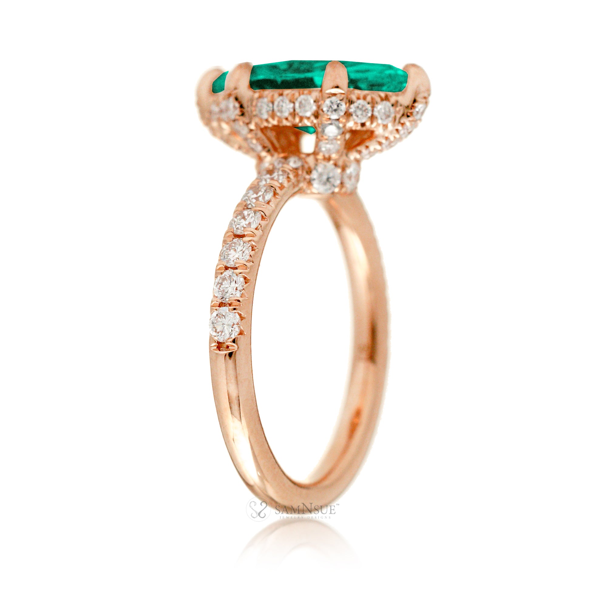 Marquise cut engagement ring with hidden halo and a rounded diamond band in rose gold