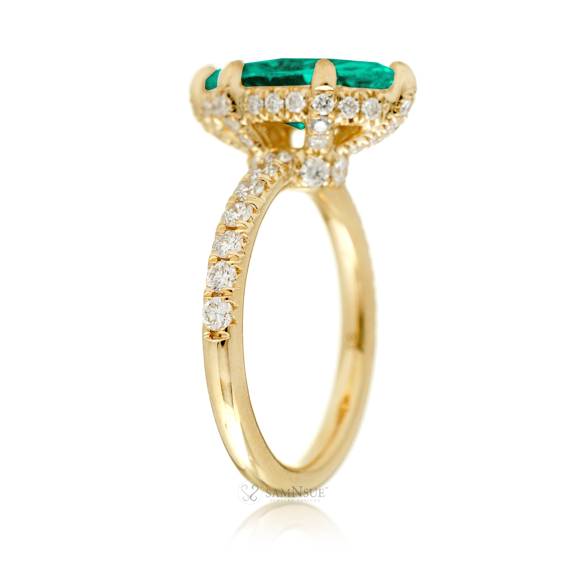 Marquise cut engagement ring with hidden halo and a rounded diamond band in yellow gold