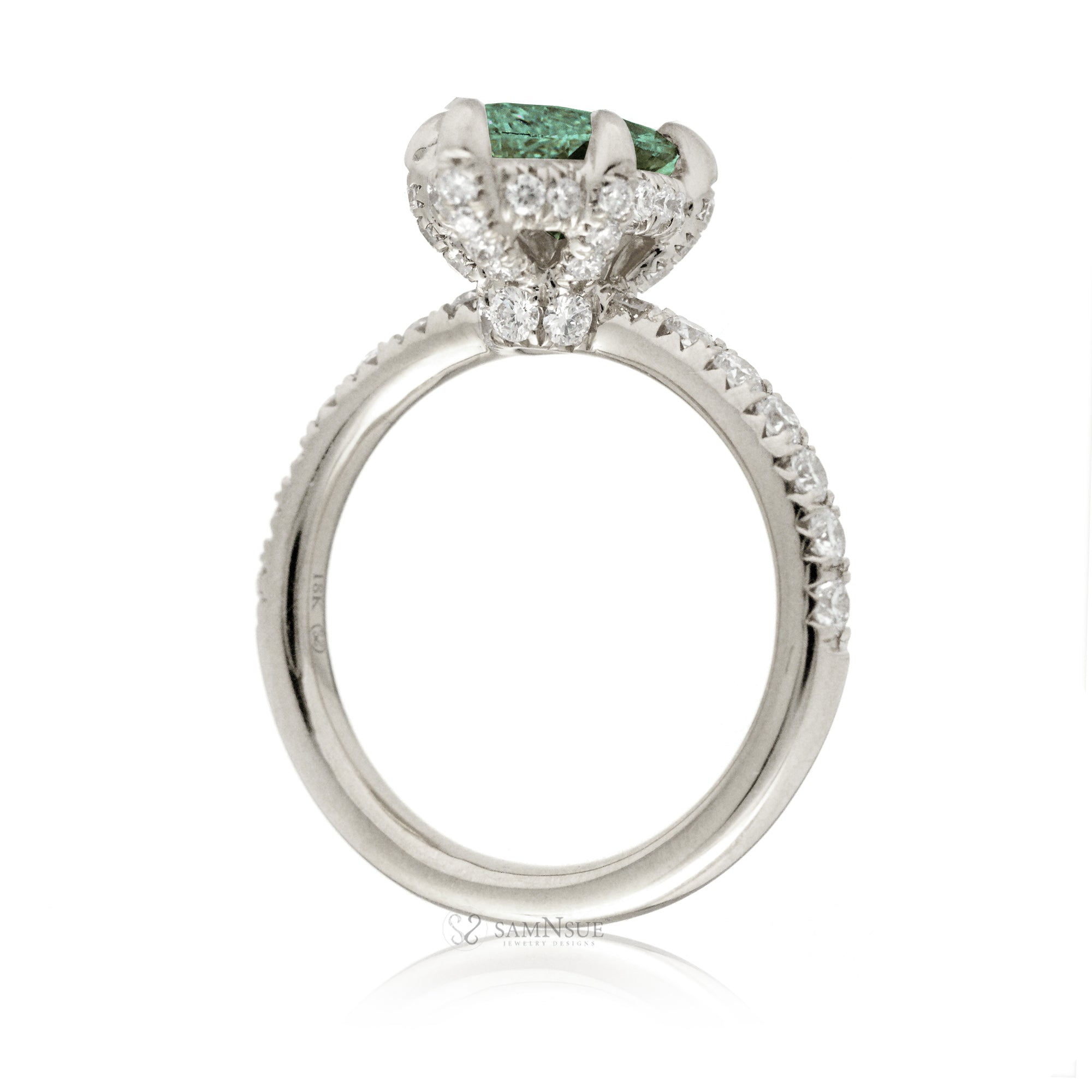 Green sapphire engagement ring with marquise and hidden diamond halo band in white gold