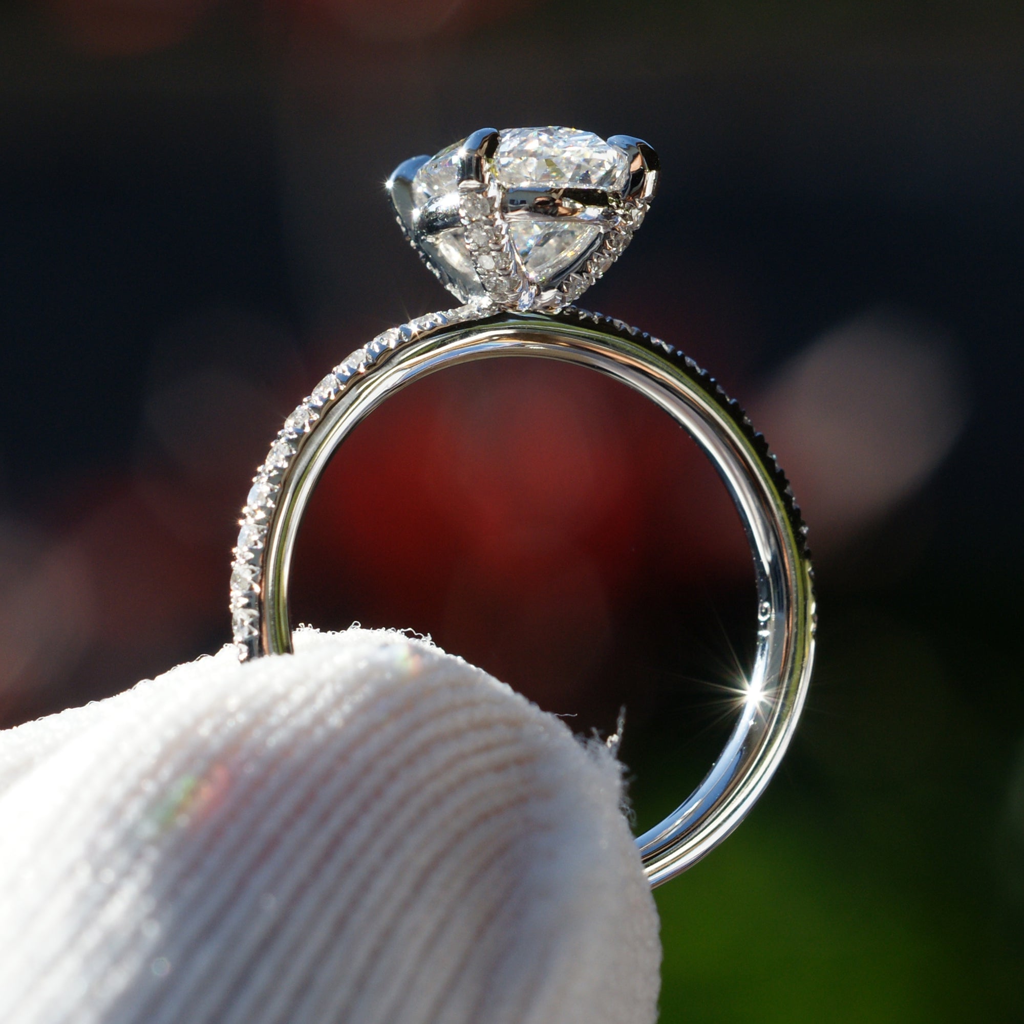 Oval diamond engagement ring in platinum with 1.5 carat center stone and  1.8mm diamond band