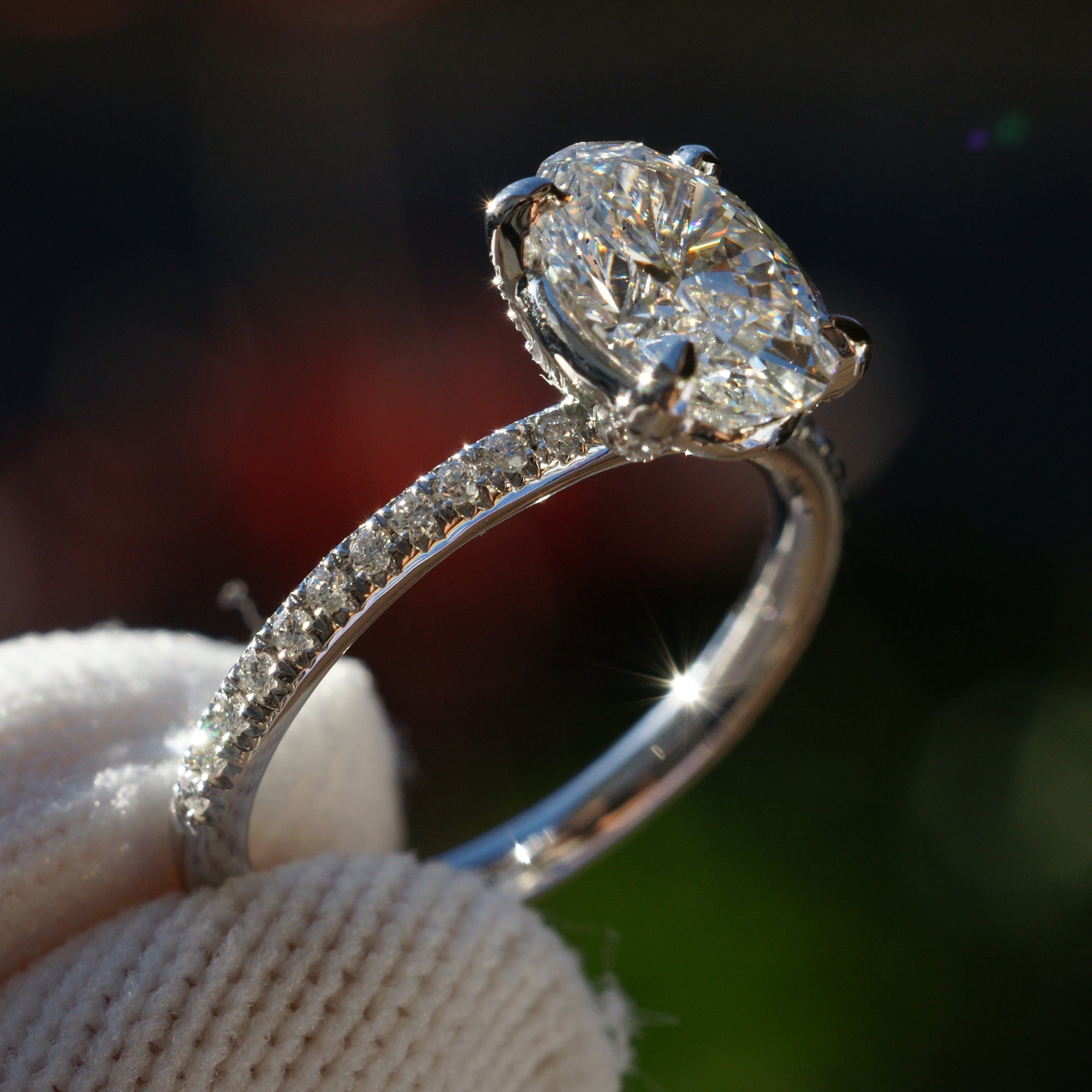 Oval diamond engagement ring in platinum with 1.5 carat center stone and  1.8mm diamond band