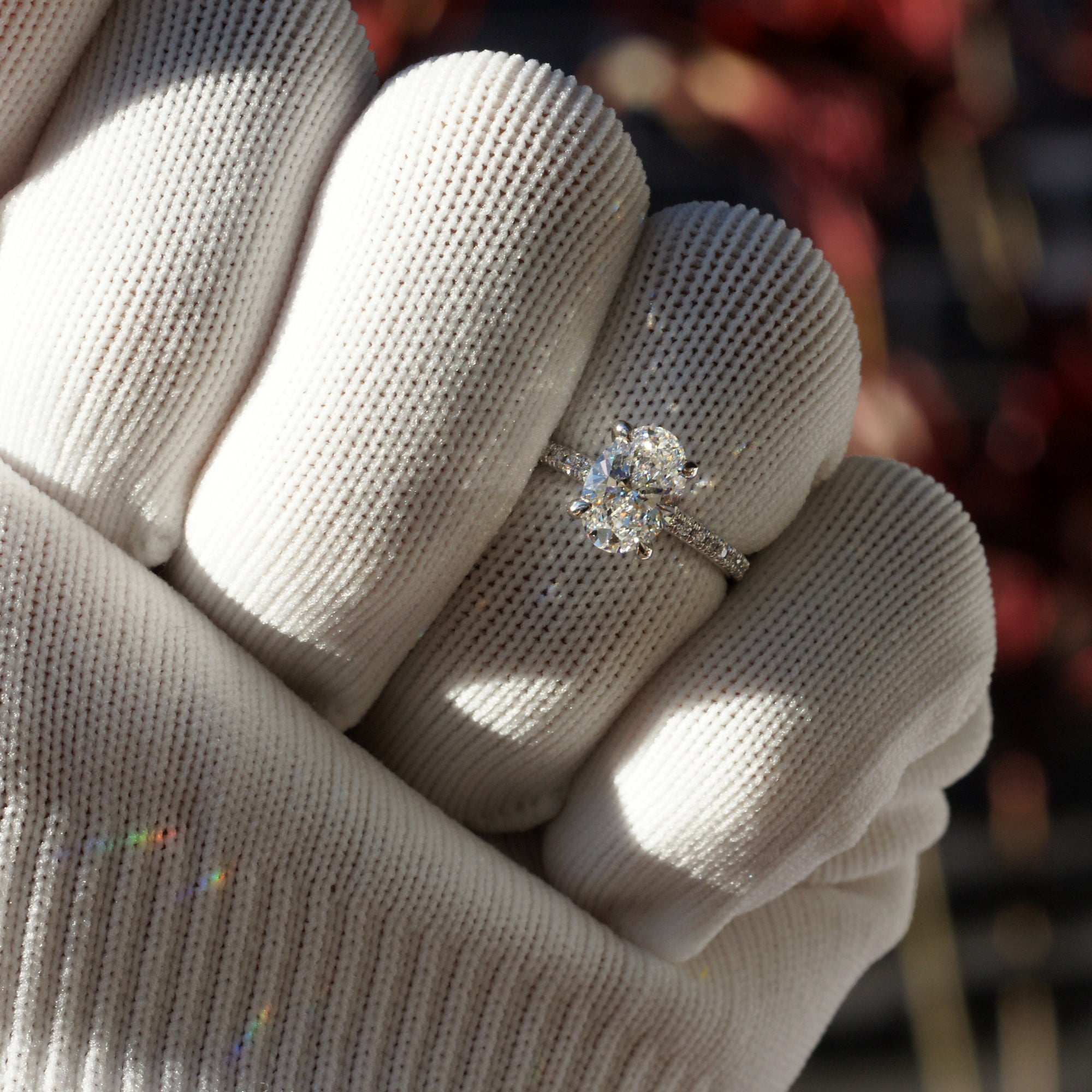 Oval diamond engagement ring in platinum with 1.5 carat center stone and  1.8mm diamond band