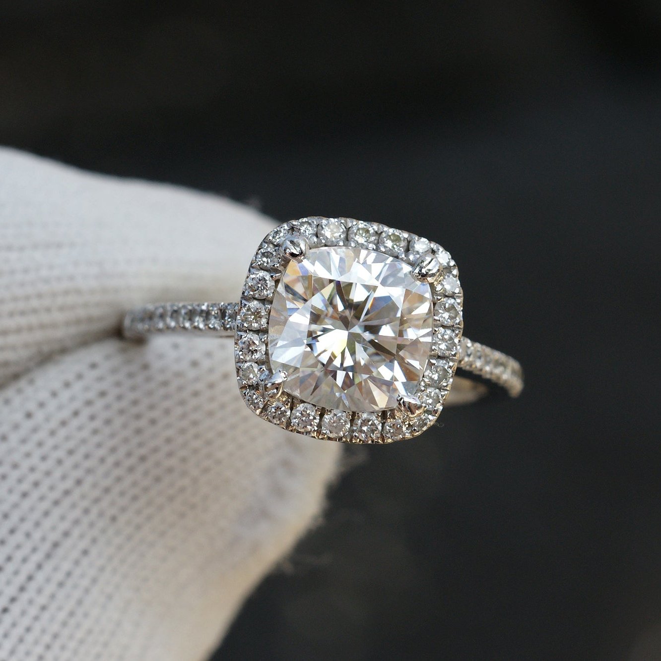 Cushion cut moissanite ring with diamond halo in white gold