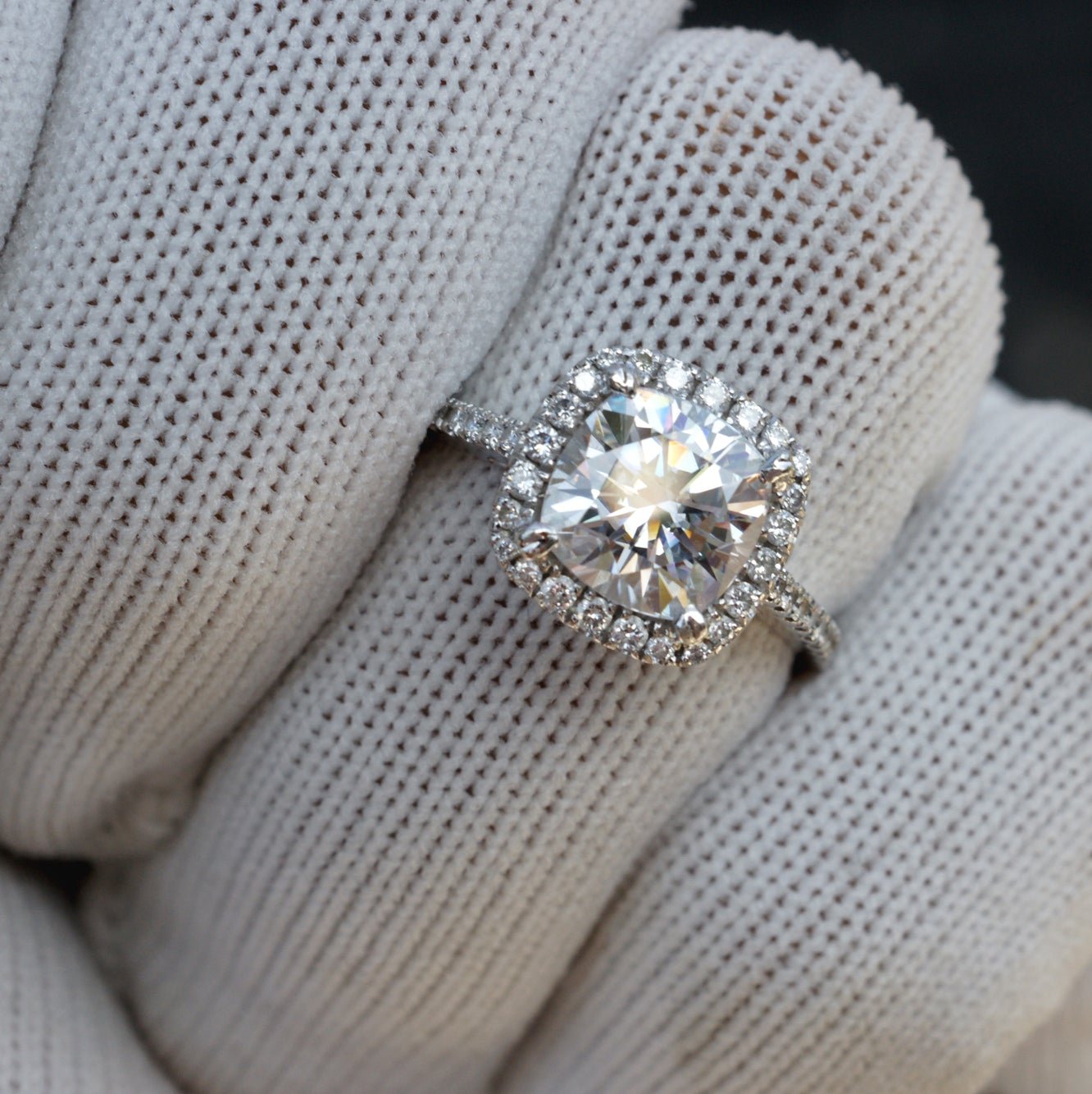 Cushion cut moissanite ring with diamond halo in white gold