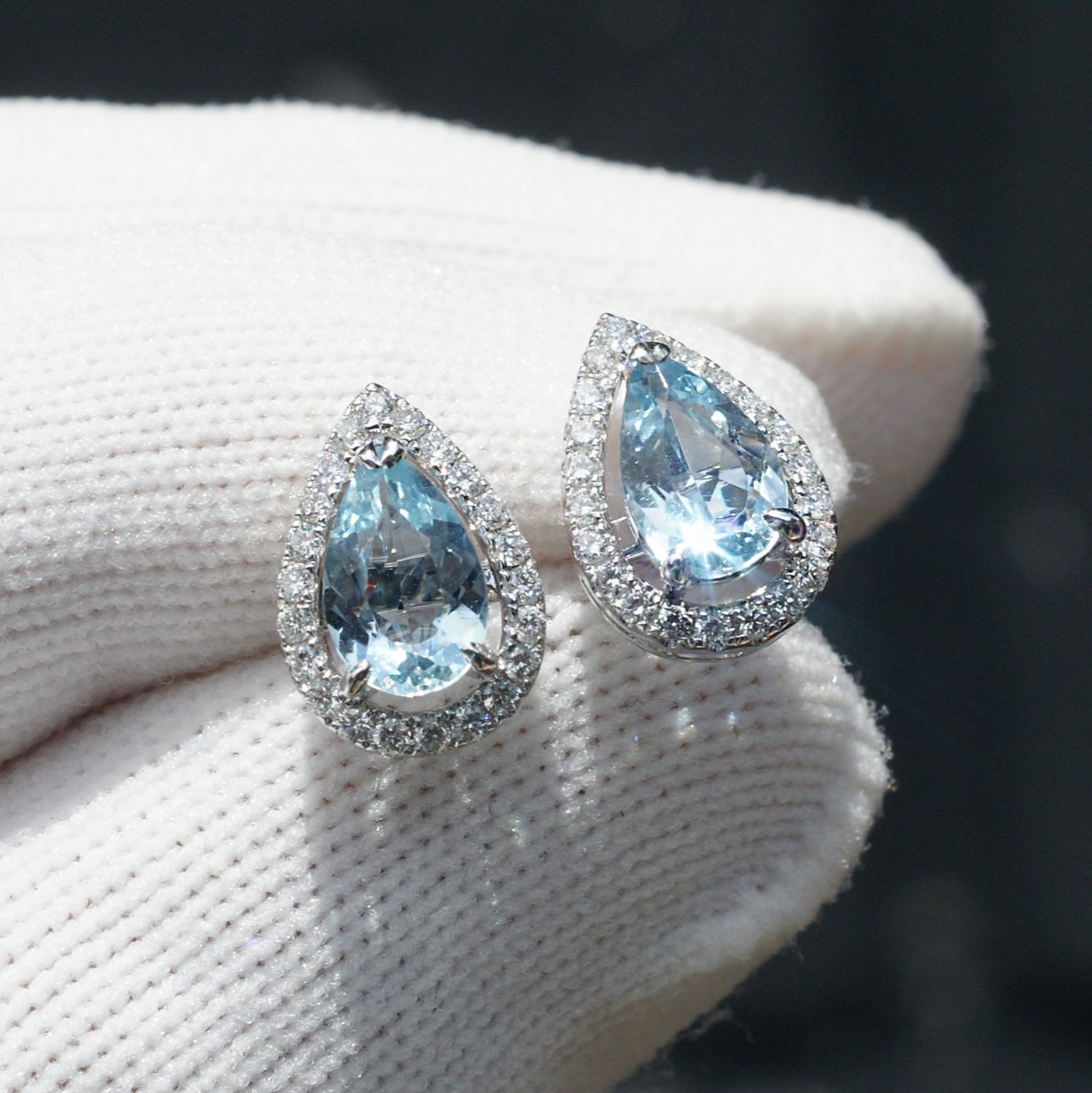 Pear cut aquamarine teardrop and diamond halo stud earrings in white gold