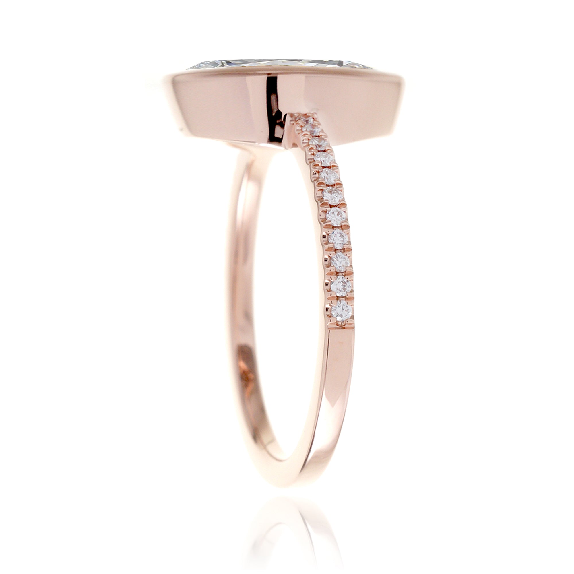 Marquise cut bezel set engagement ring in rose gold