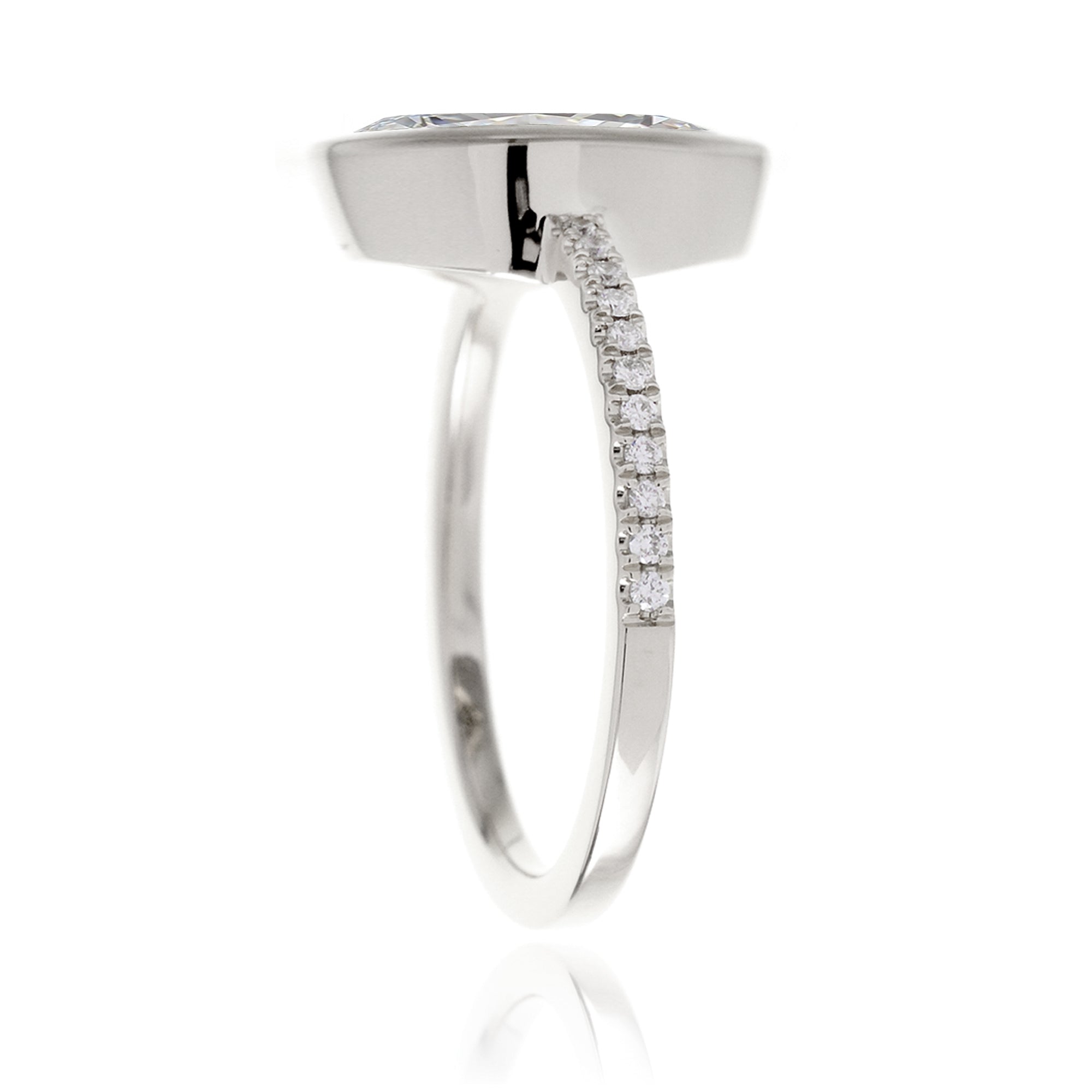 Marquise cut bezel set engagement ring in white gold