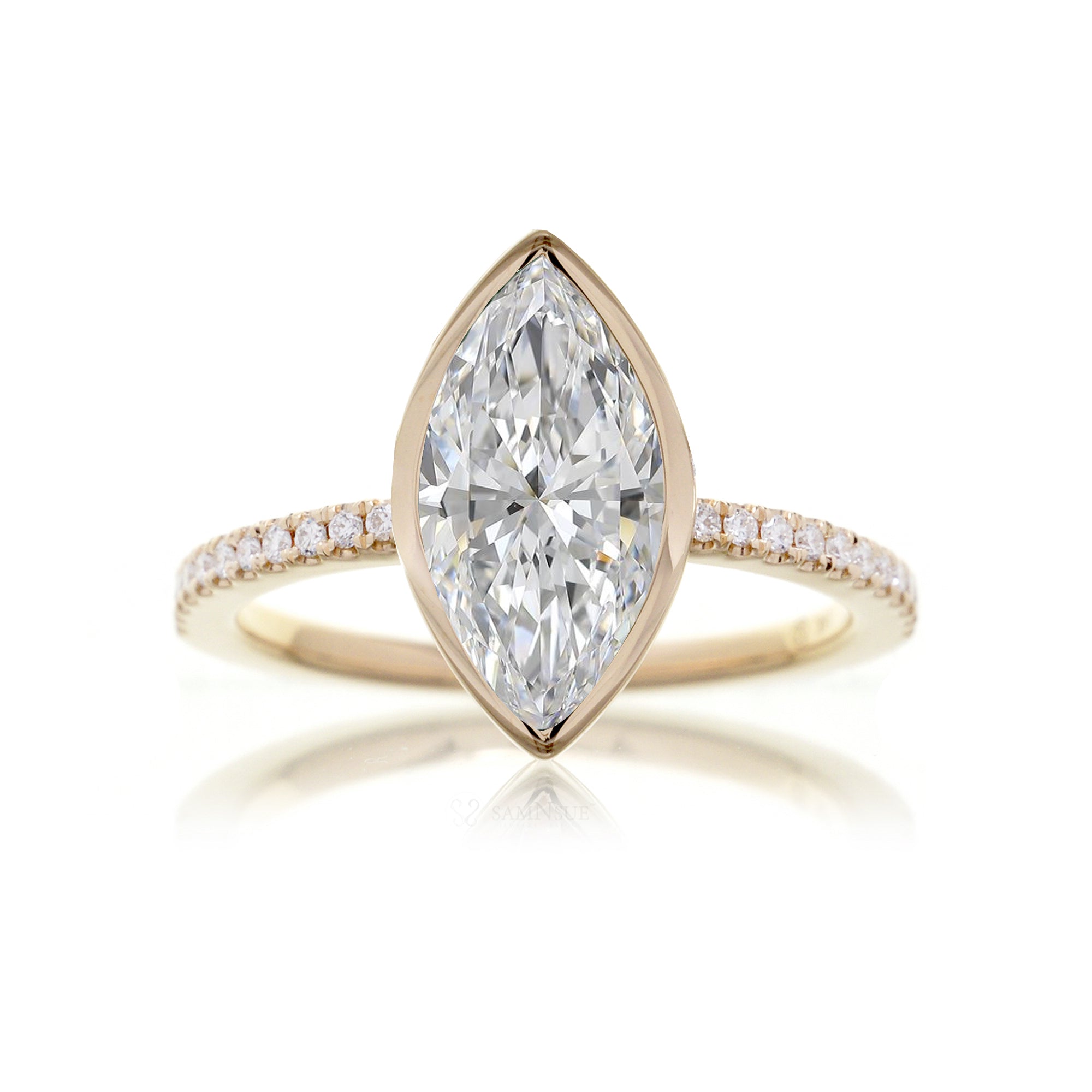 Marquise cut bezel set engagement ring in yellow gold