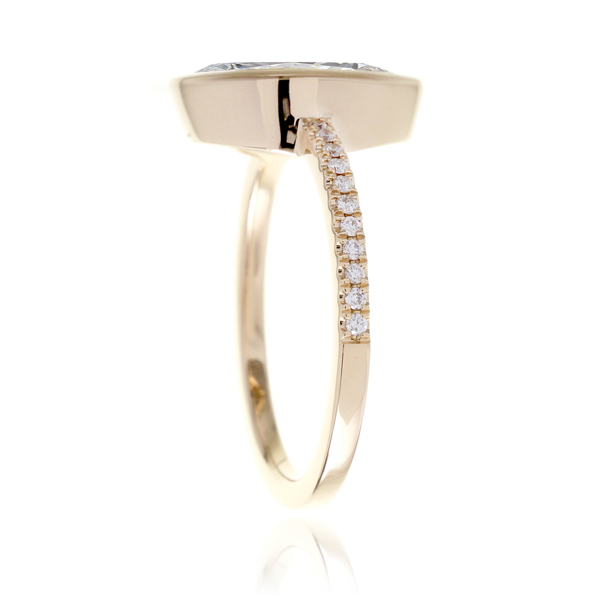 Marquise cut bezel set engagement ring in yellow gold