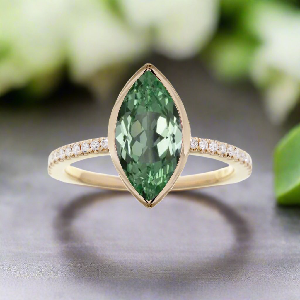 Marquise cut green sapphire bezel solitaire engagement ring yellow gold