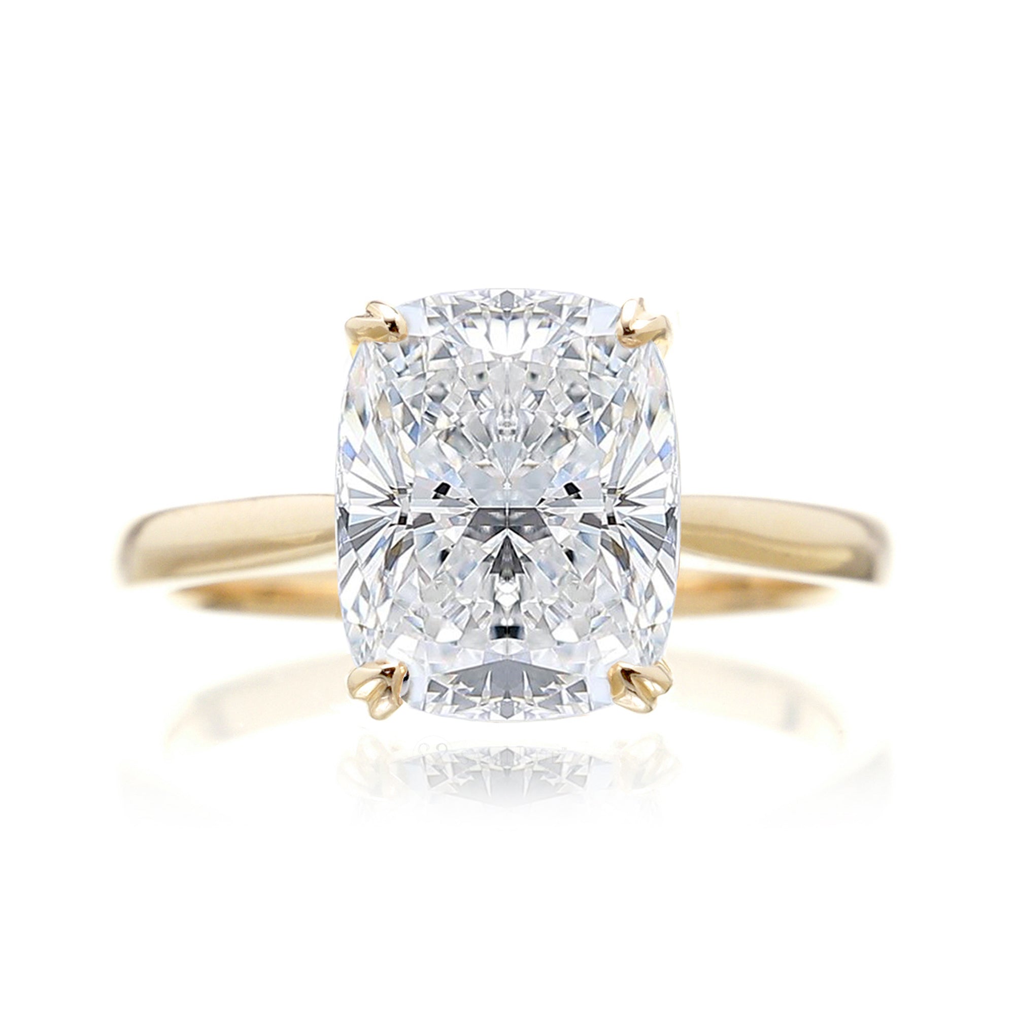 Cushion diamond solitaire engagement ring with solid band in yellow gold