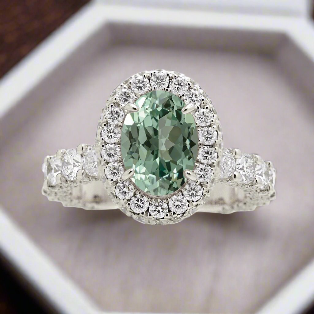 Oval green sapphire diamond engagement ring with halo