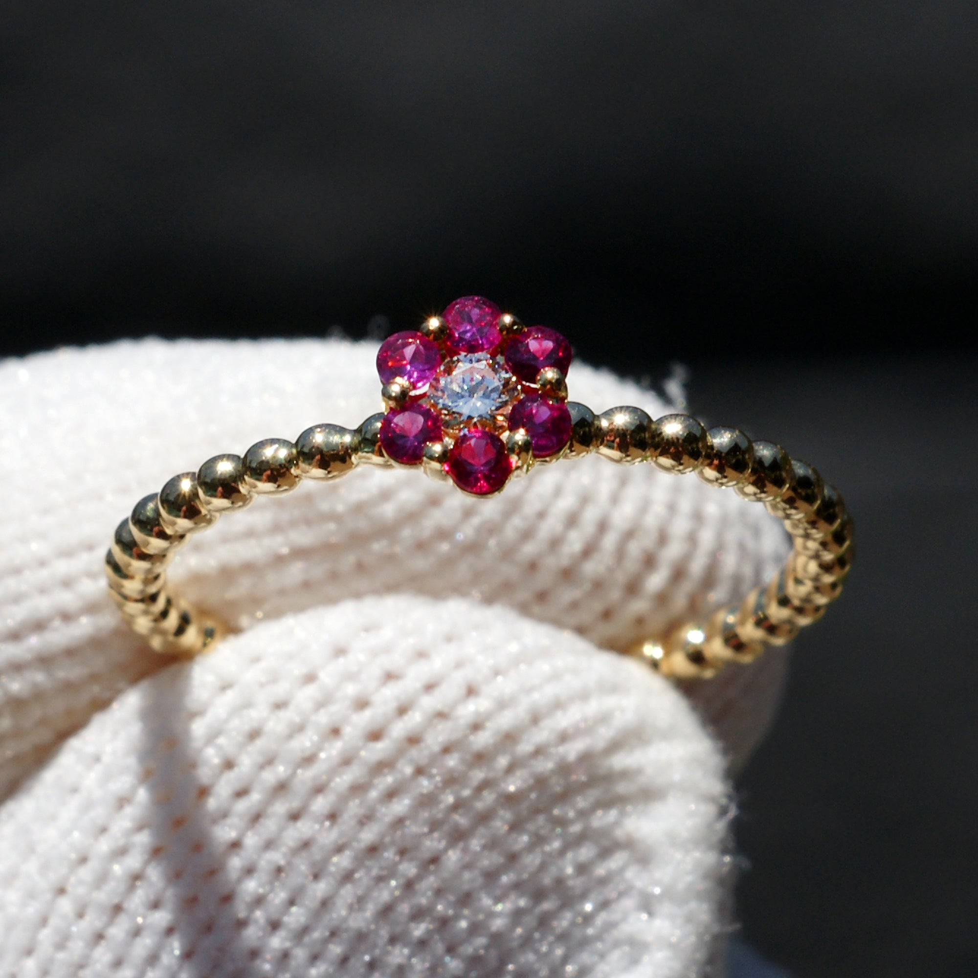 Flower ruby and diamond ring with beaded yellow gold band