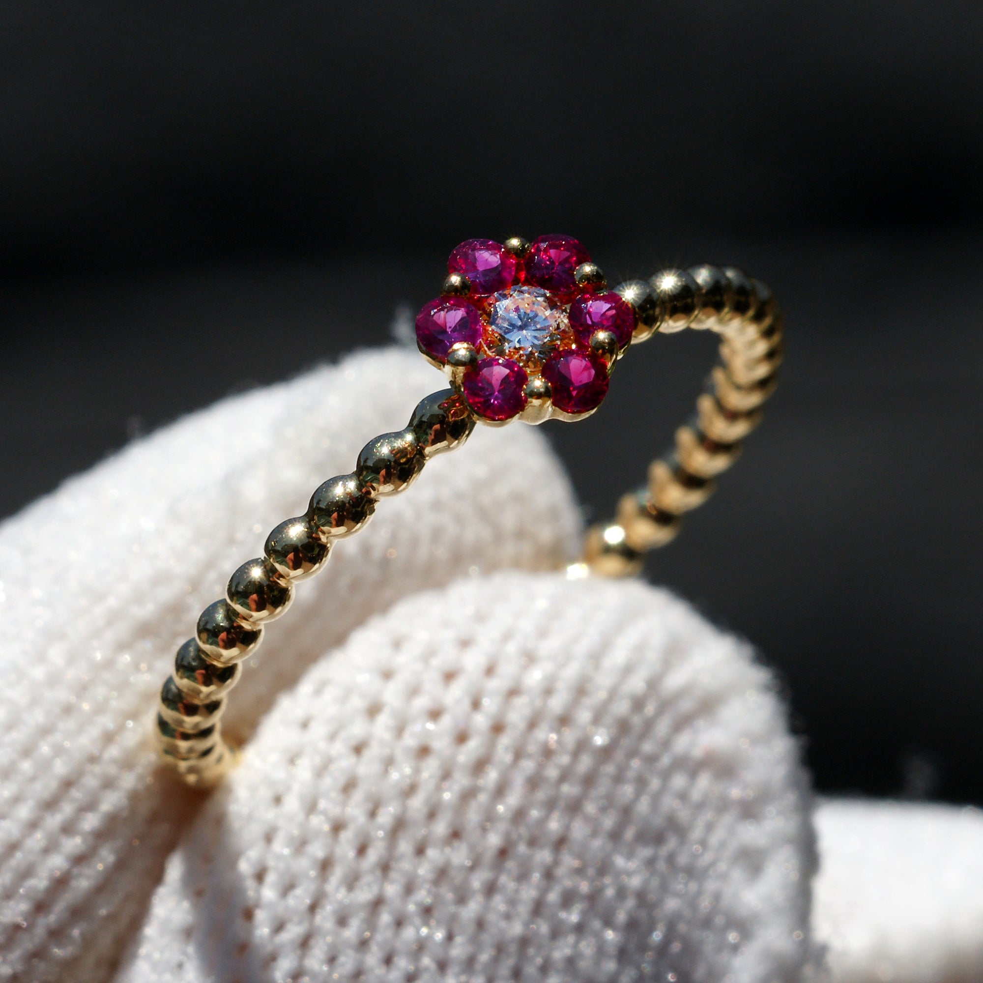 Flower ruby and diamond ring with beaded yellow gold band