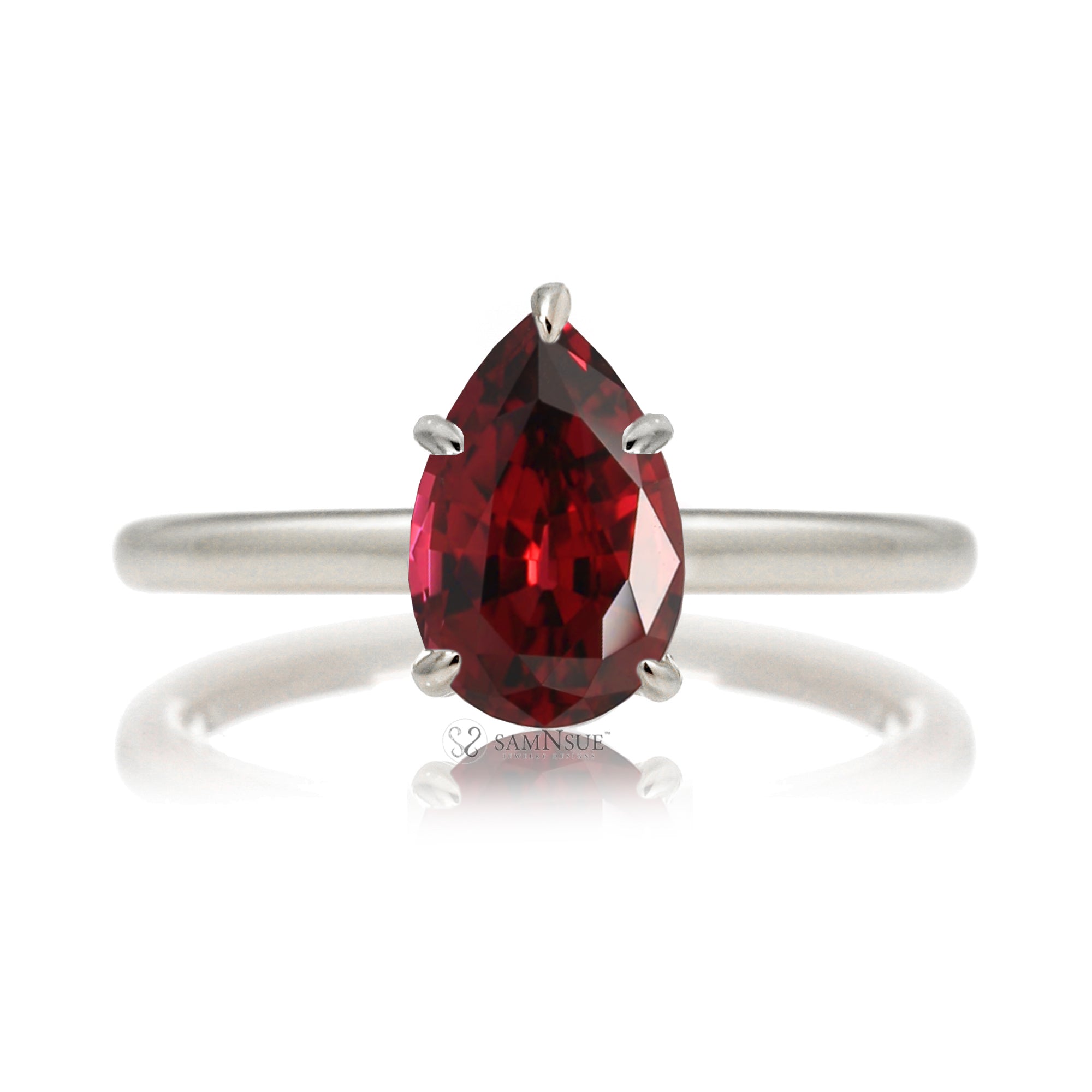 Pear ruby solitaire engagement ring in white gold with hidden halo