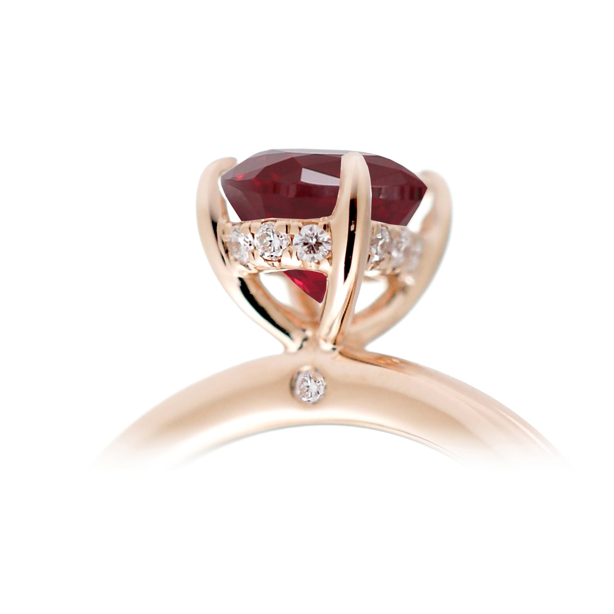 Ruby ring with princess cut and hidden halo with a rounded rose gold band