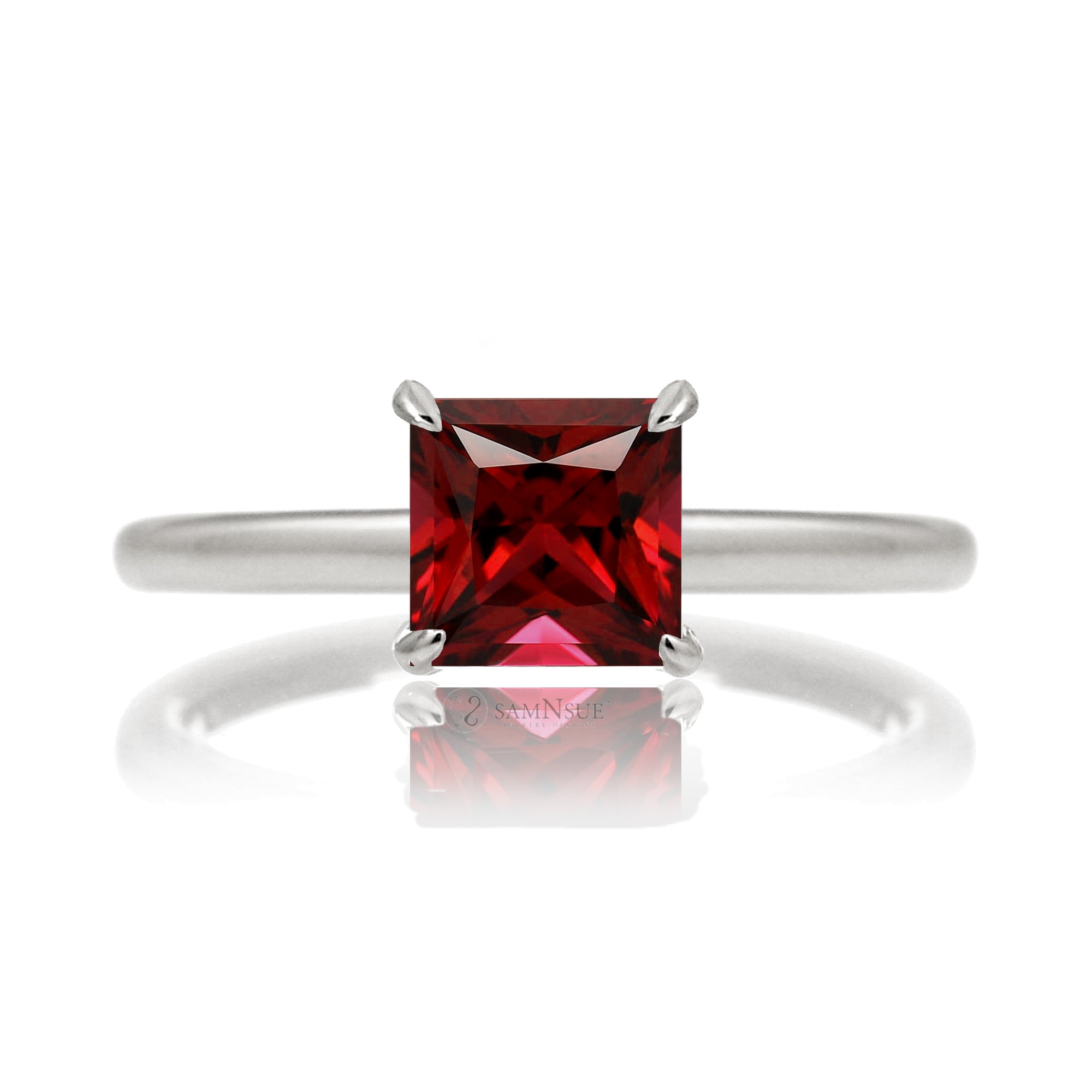 Ruby ring with princess cut and hidden halo with a rounded white gold band