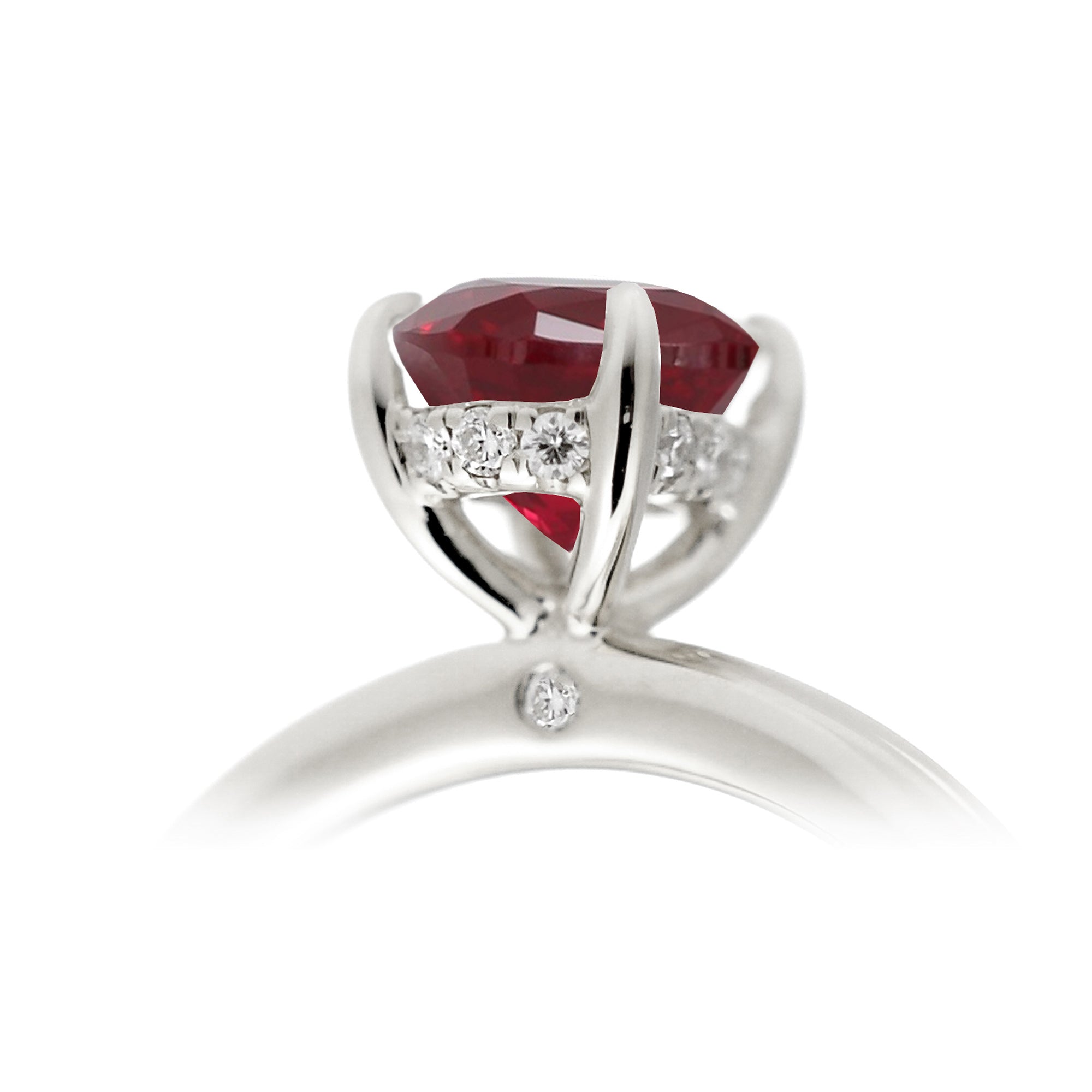 Ruby ring with princess cut and hidden halo with a rounded white gold band