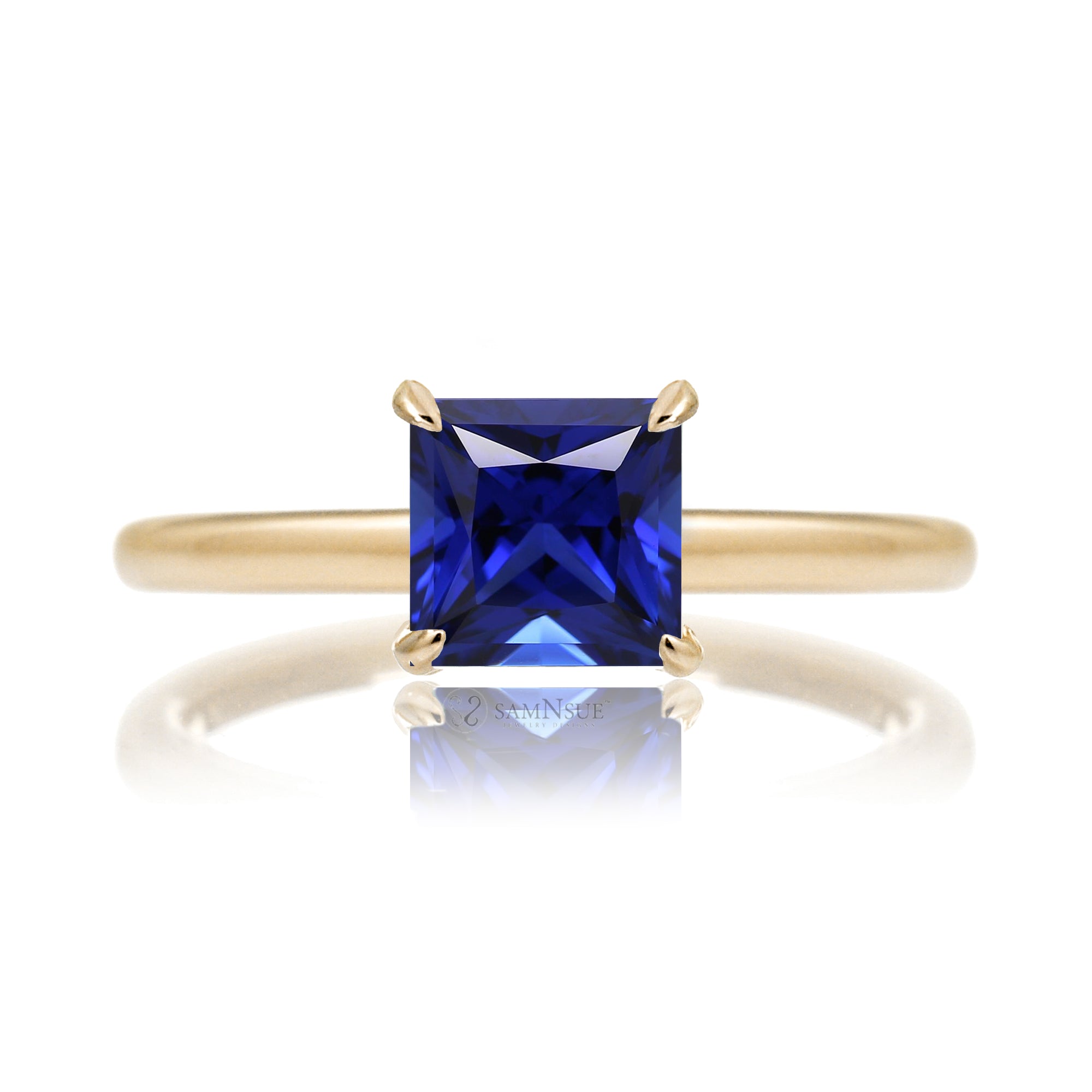 Princess cut blue sapphire solitaire ring in yellow gold