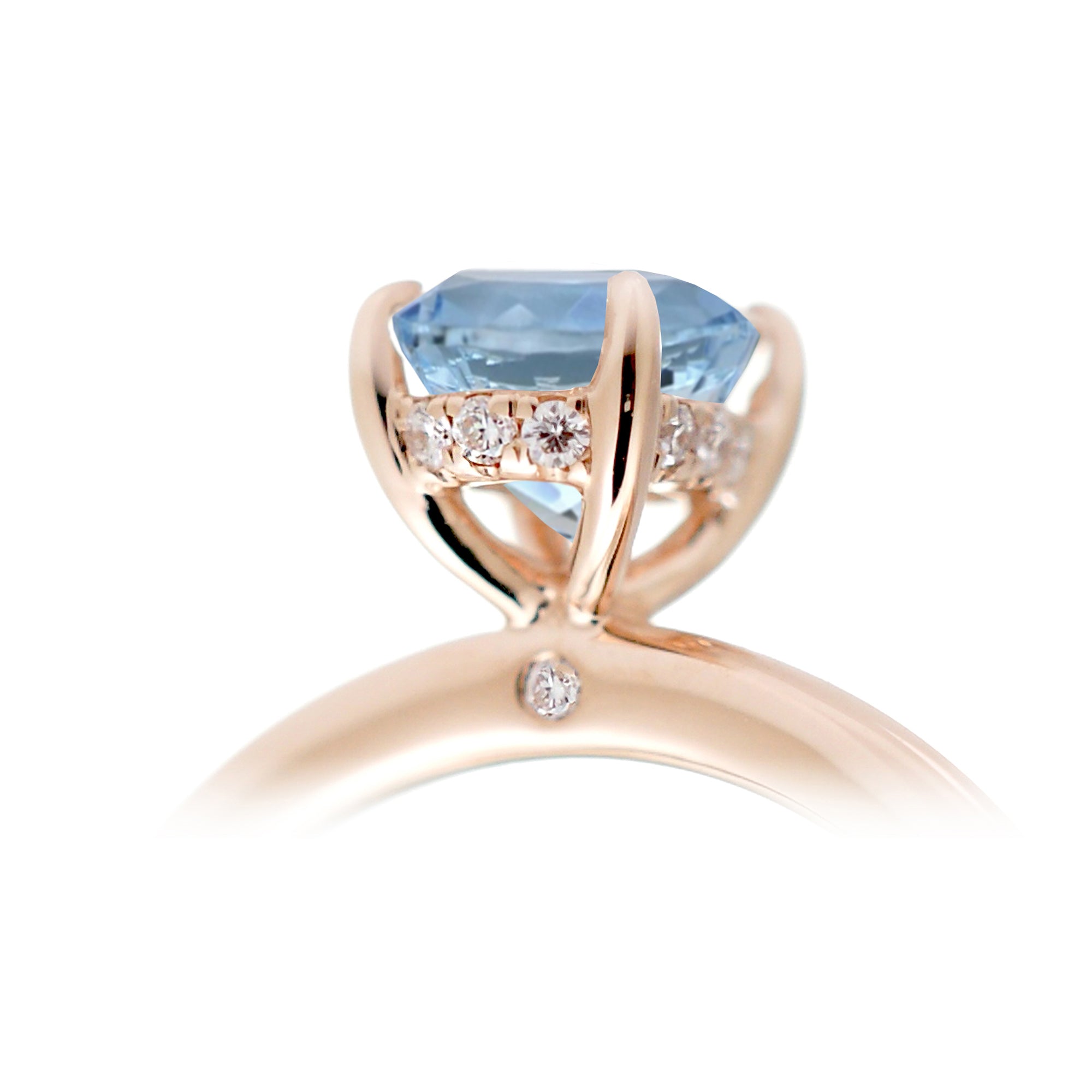 Round aquamarine ring with a diamond hidden halo in rose gold