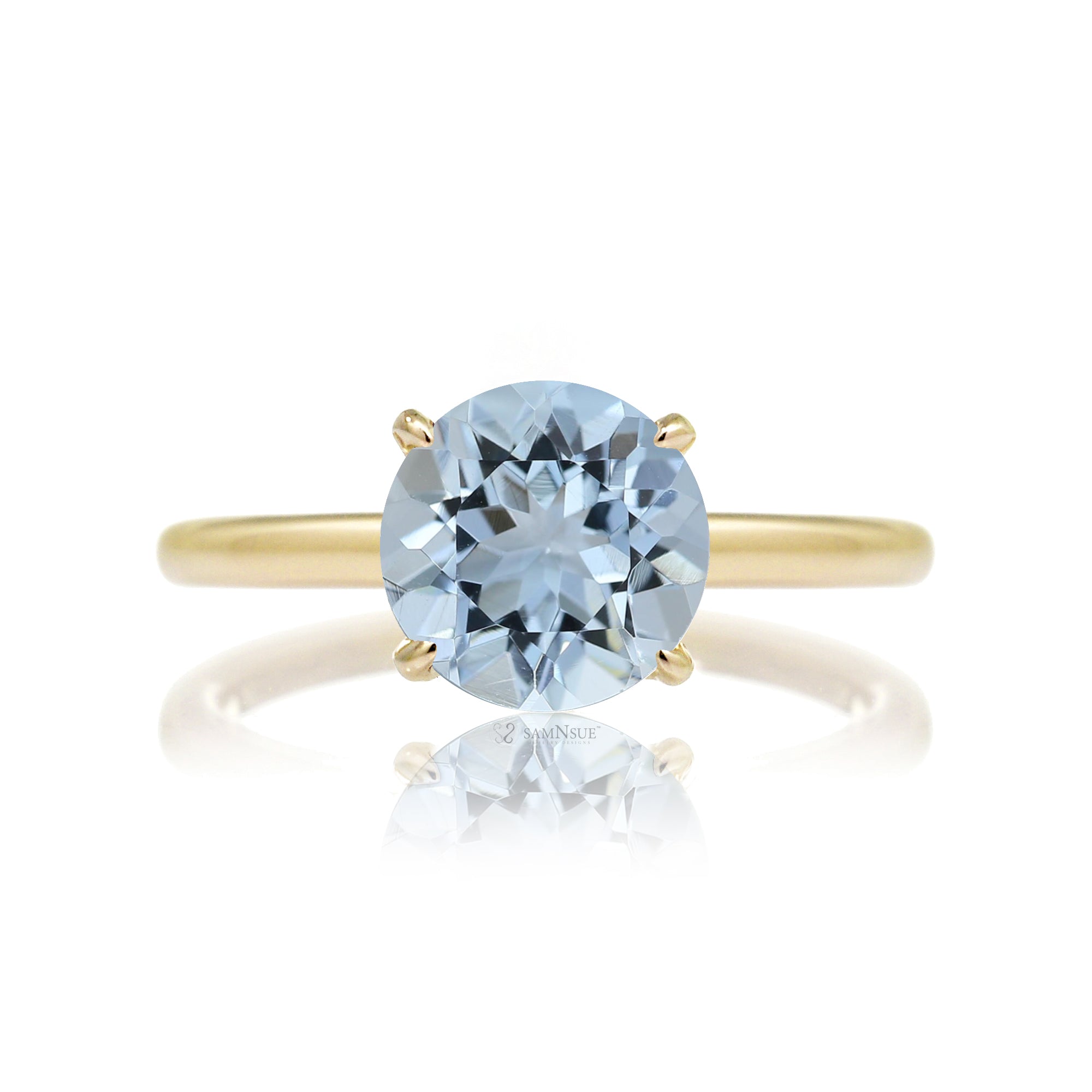 Round aquamarine ring with a diamond hidden halo in yellow gold