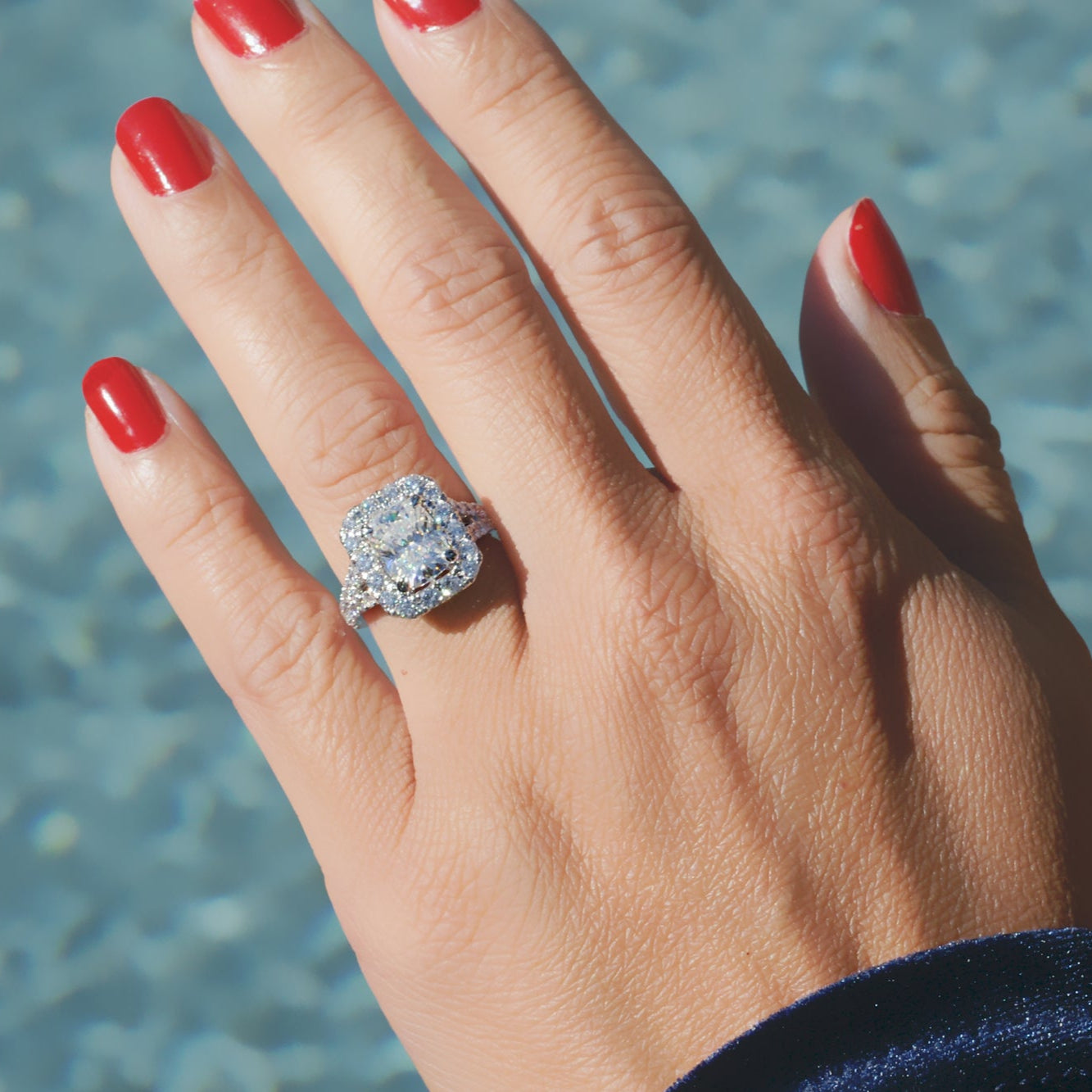 Cushion diamond ring with large halo and split band setting