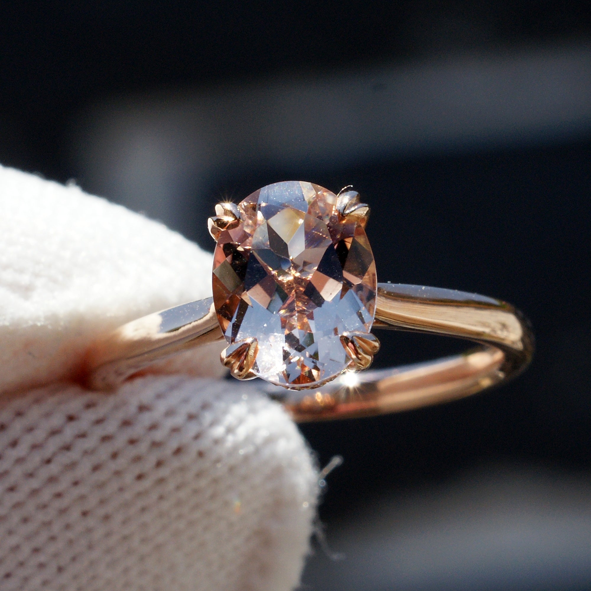 Oval morganite solitaire engagement ring with hidden diamond halo in rose gold