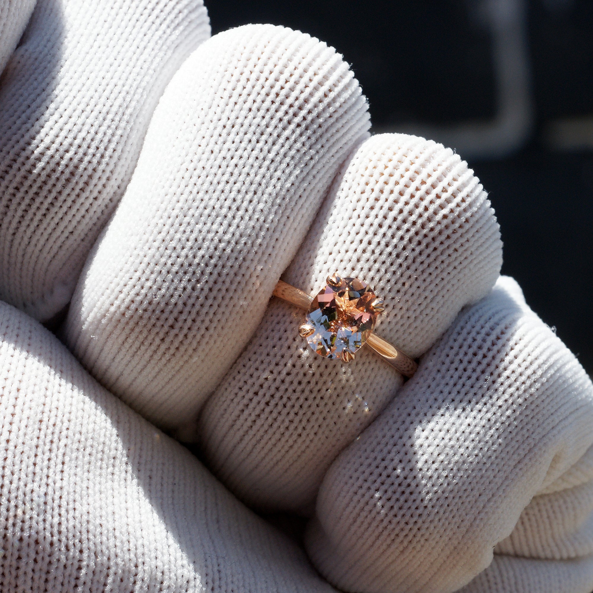 Oval morganite solitaire engagement ring with hidden diamond halo in rose gold