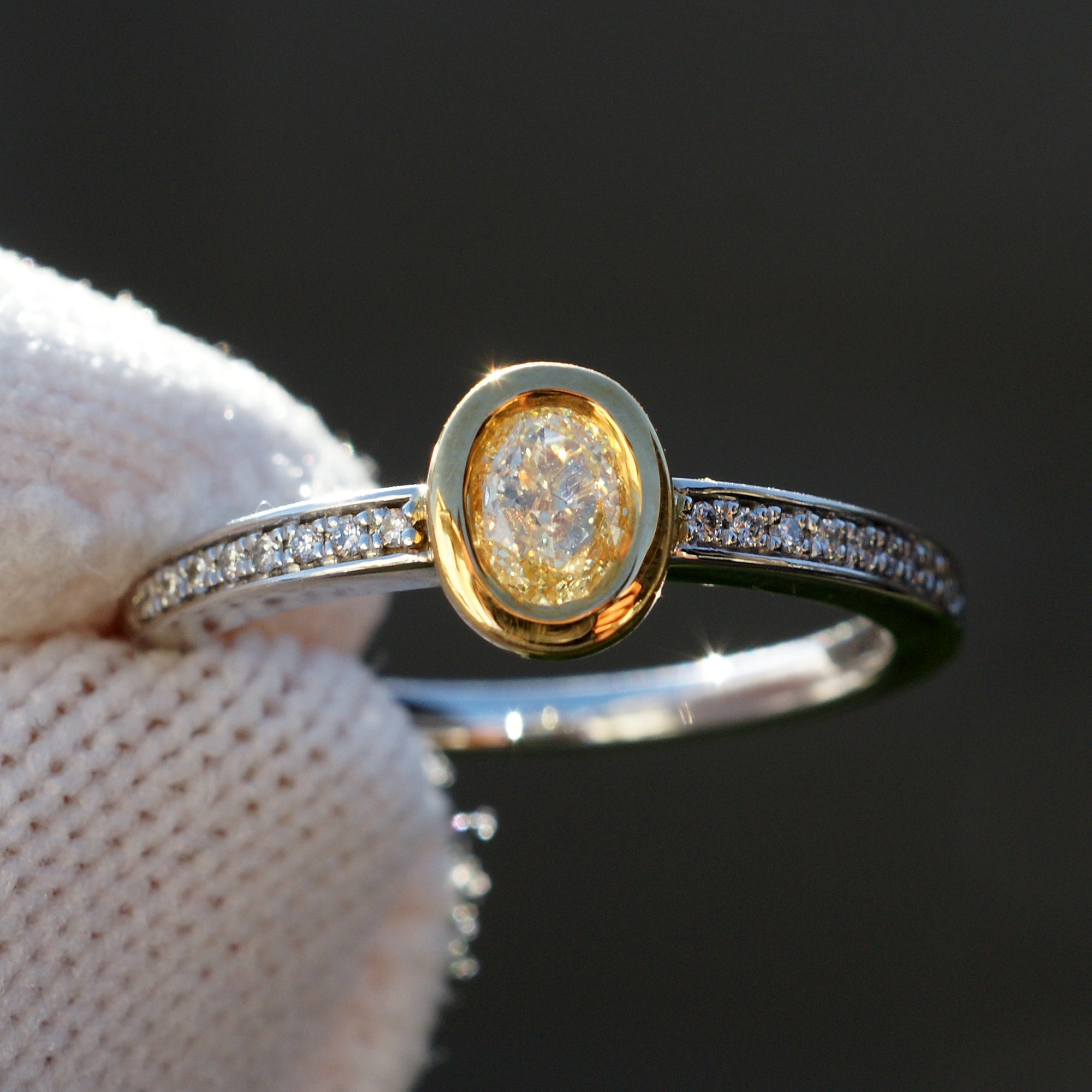 Fancy yellow diamond solitaire bezel engagement ring