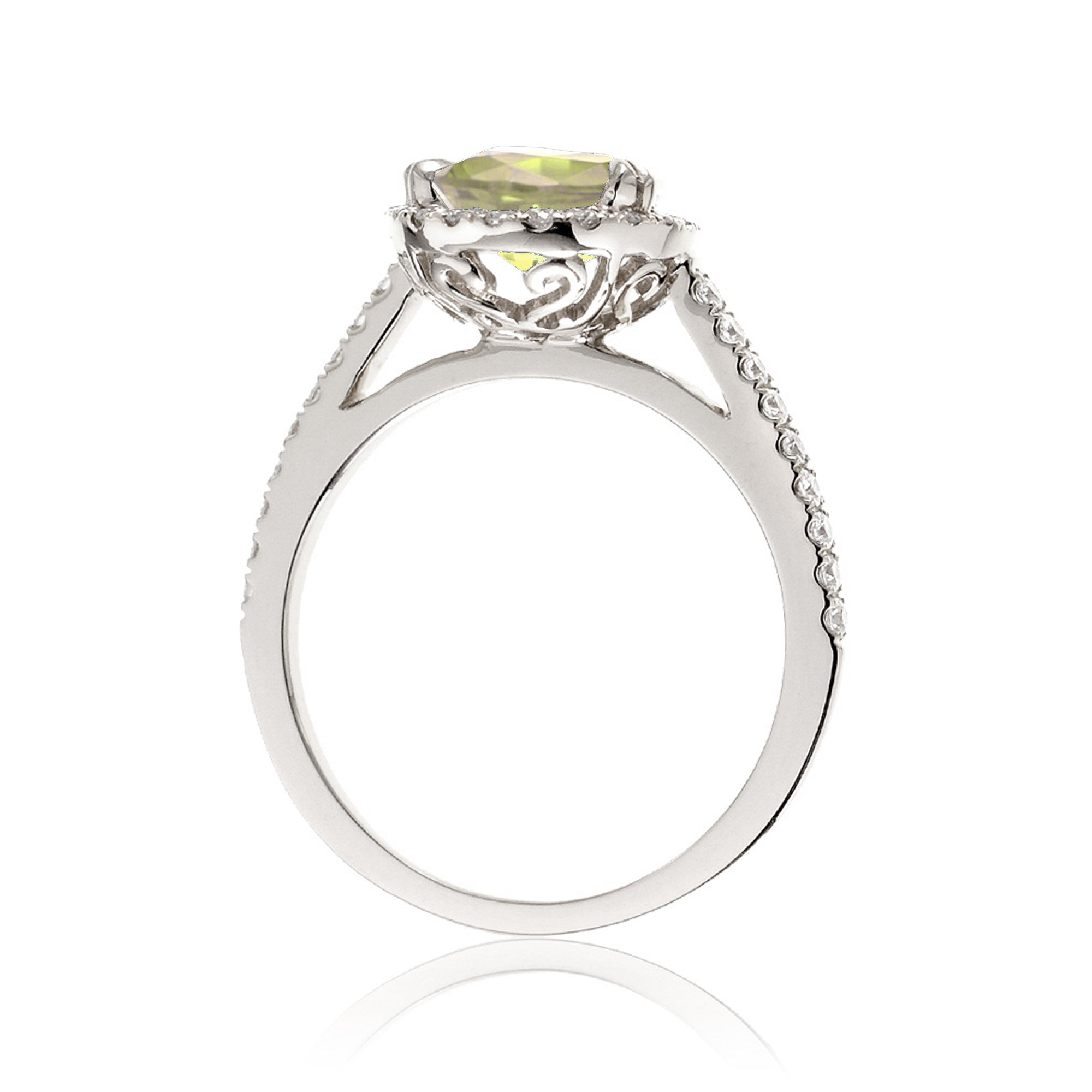 Oval cut yellow sapphire engagement ring with a diamond halo in white gold