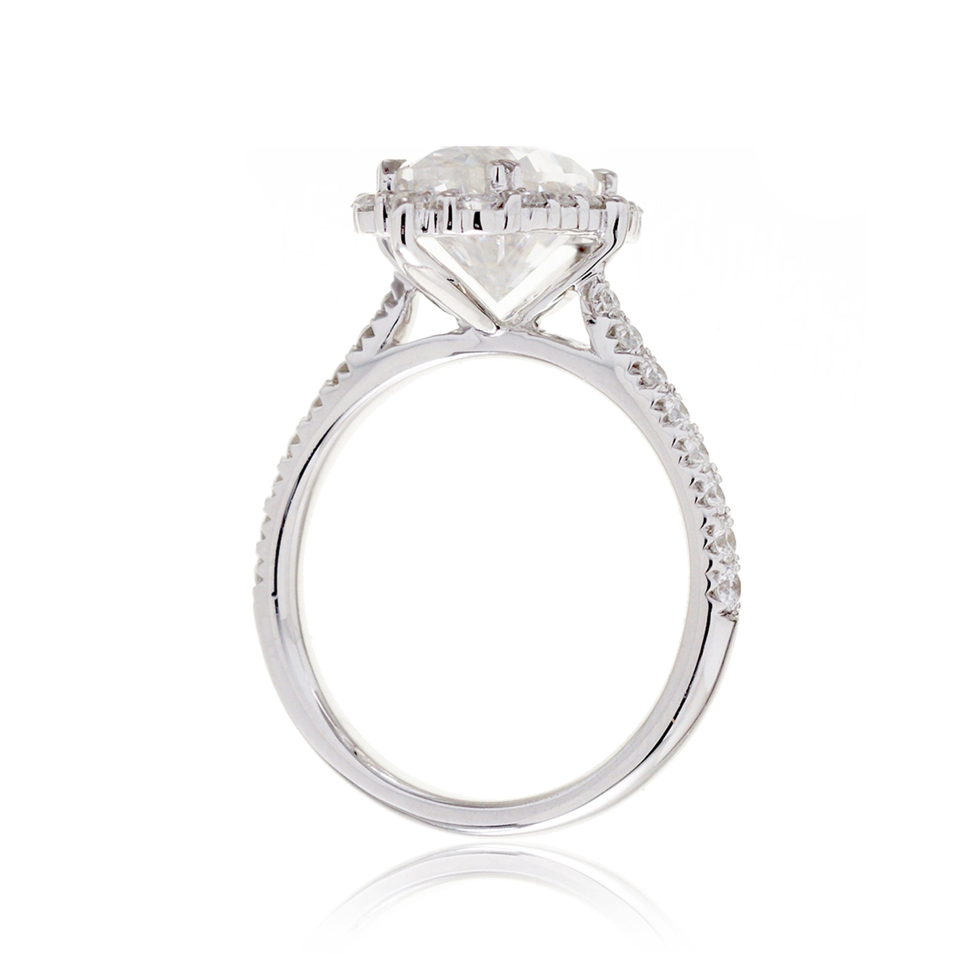 Oval diamond ring with halo and cathedral setting in white gold