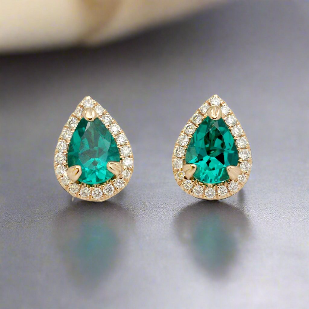 Pear emerald stud diamond halo earrings yellow gold