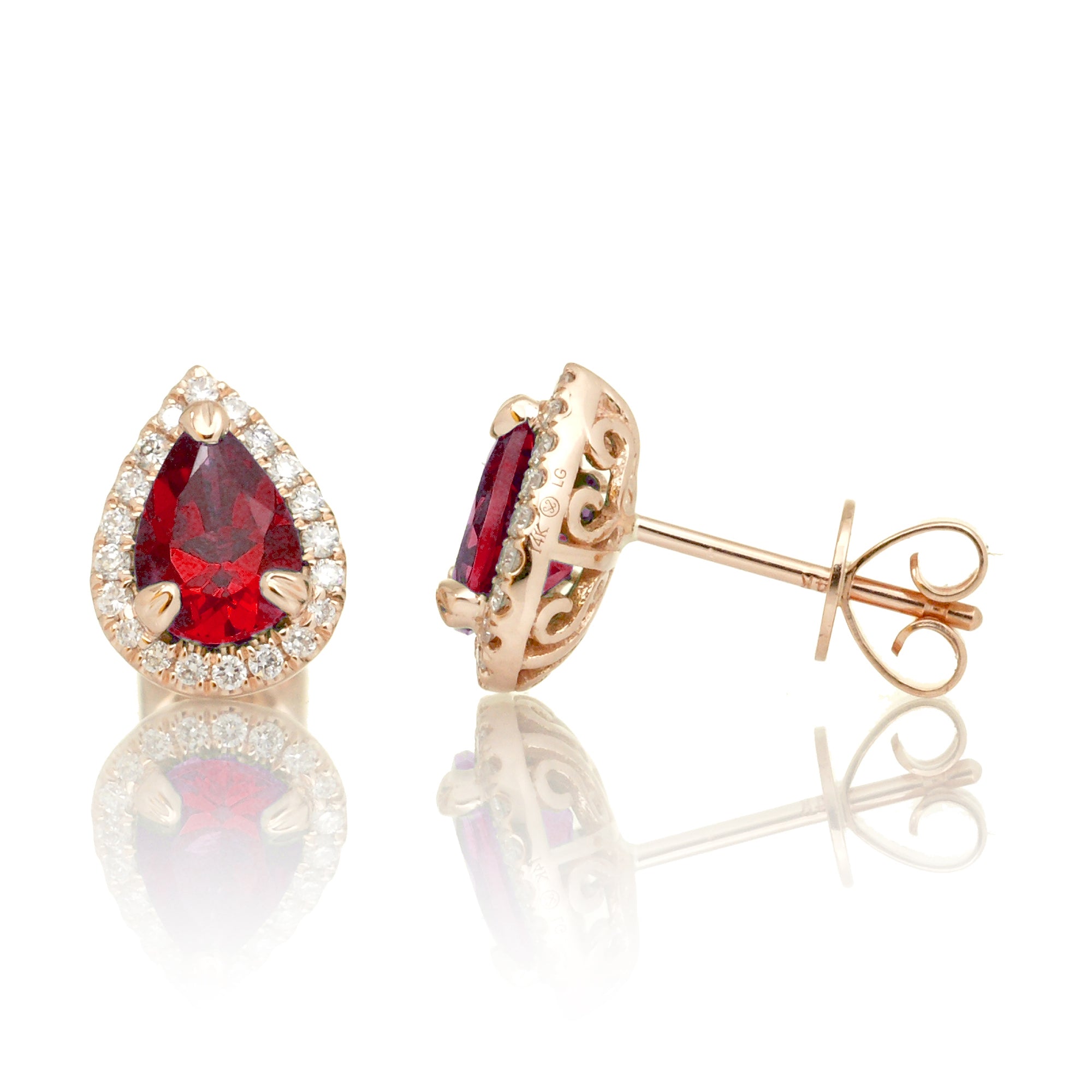 Pear ruby stud with diamond halo in rose gold