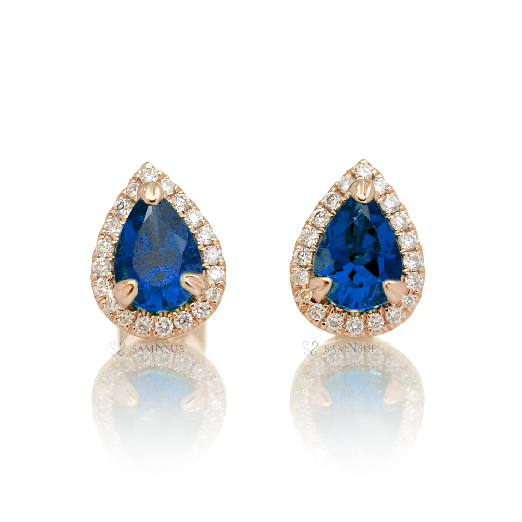 Pear blue sapphire stud with diamond halo