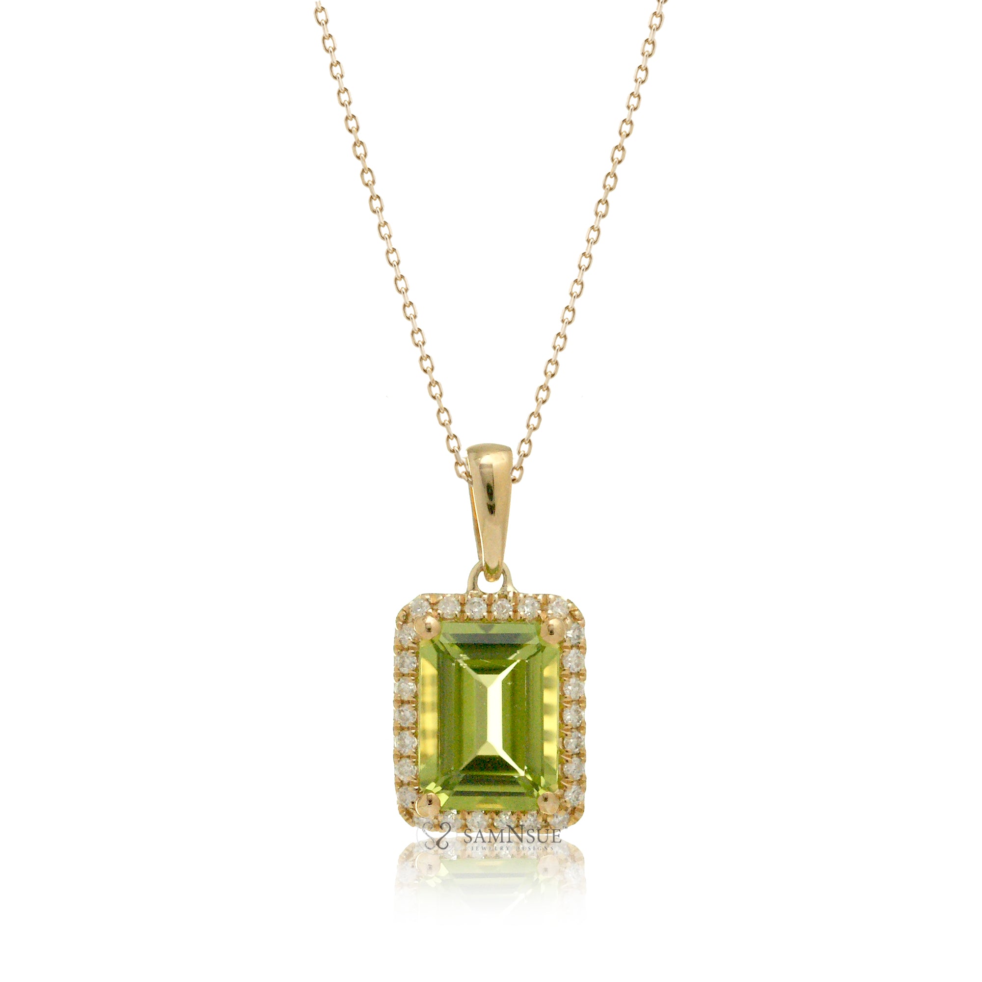 Peridot pendant with diamond halo and chain in yellow gold