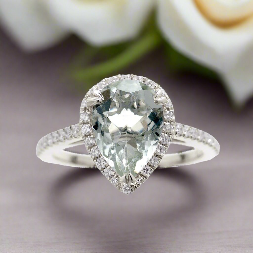 Prasiolite pear cut engagement ring with a diamond halo