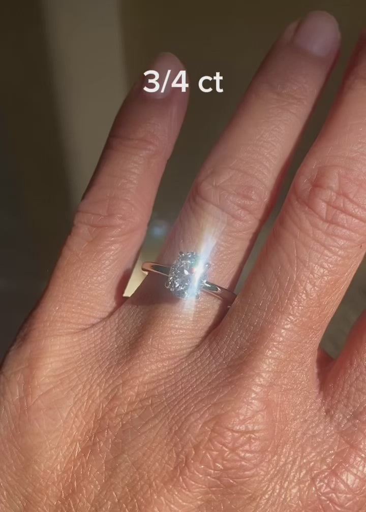 Oval diamond engagement ring with hidden halo